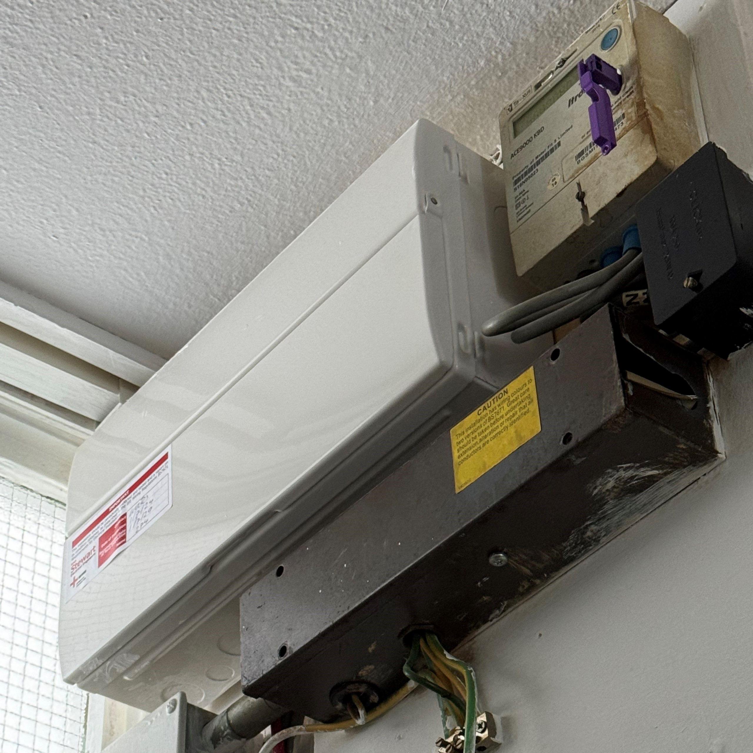 Image showing fuse box and key-operated meter fitted under the ceiling in Mr Rollinson's flat