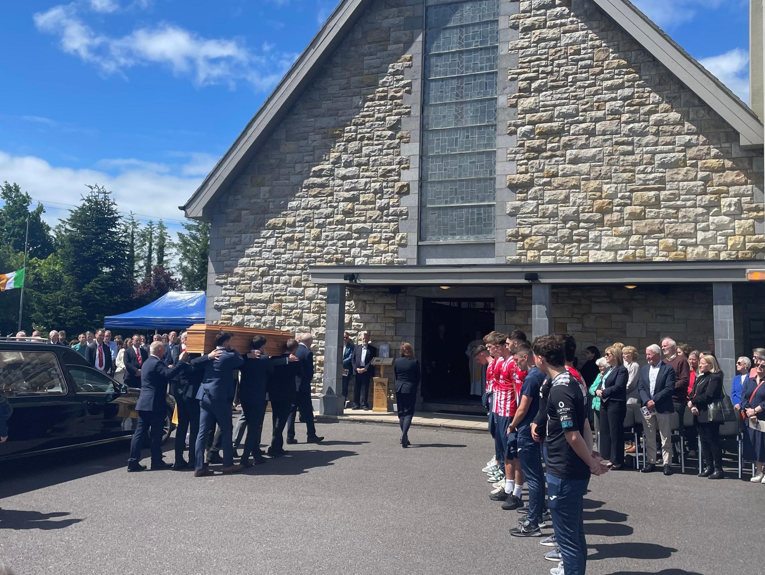 Sligo Rovers players outside church where funeral of Tommie Gorman held