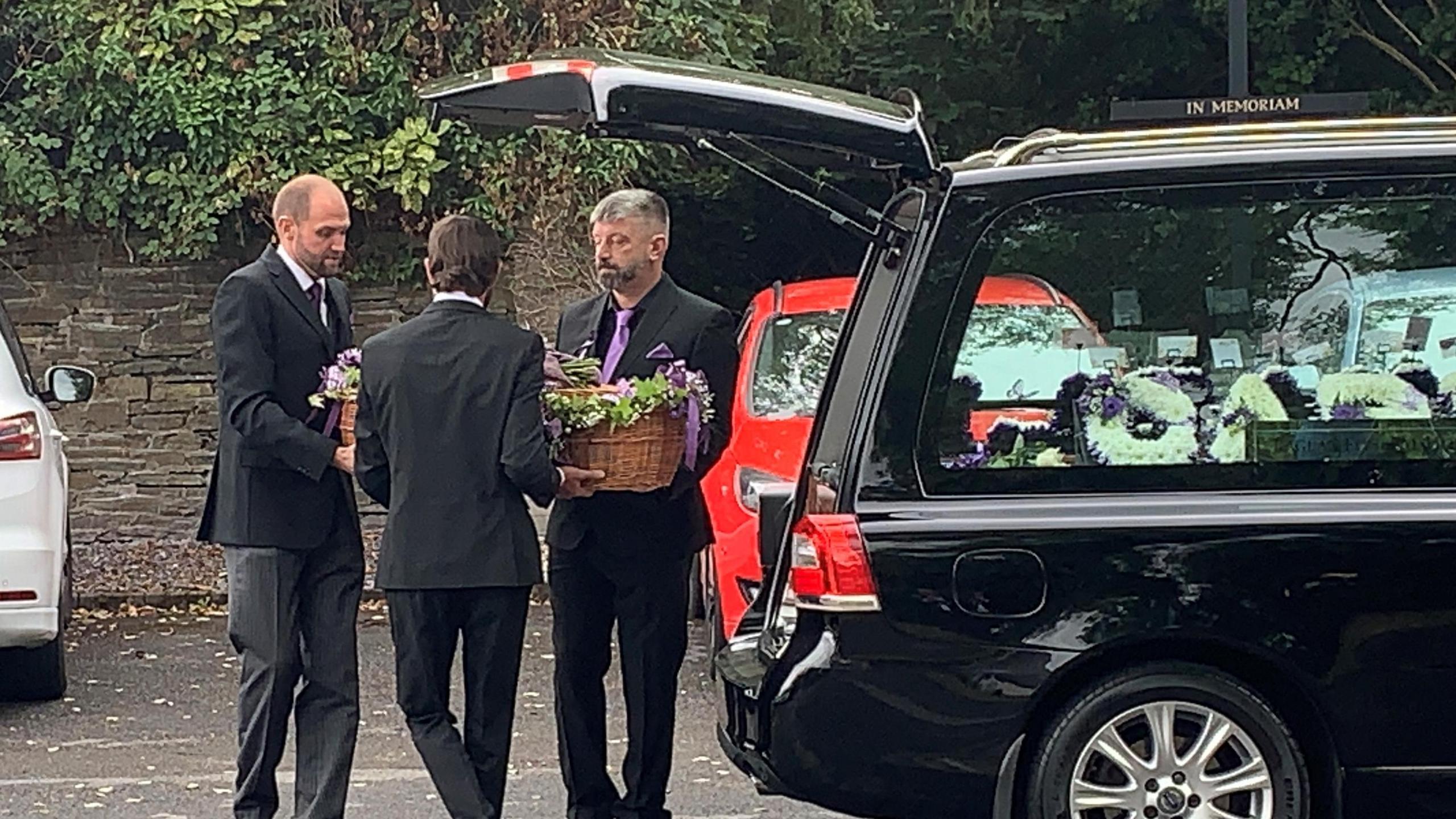 Mabli’s wicker coffin being carried in to Nodda Newydd Church