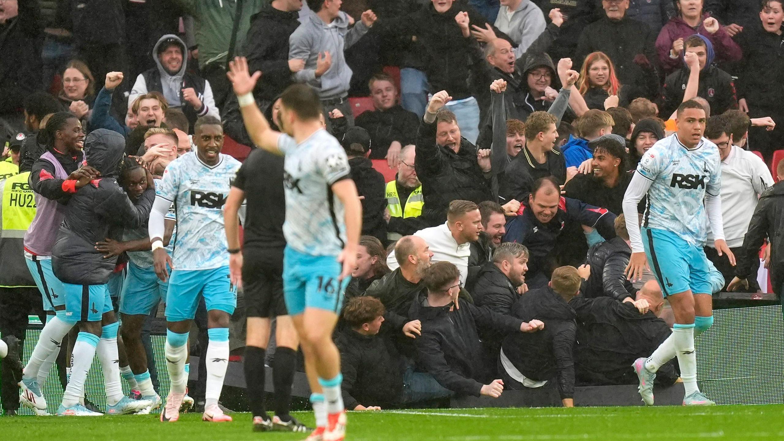 Charlton fans spill onto the pitch following Isaac Olaofe's late winner at Sheffield United