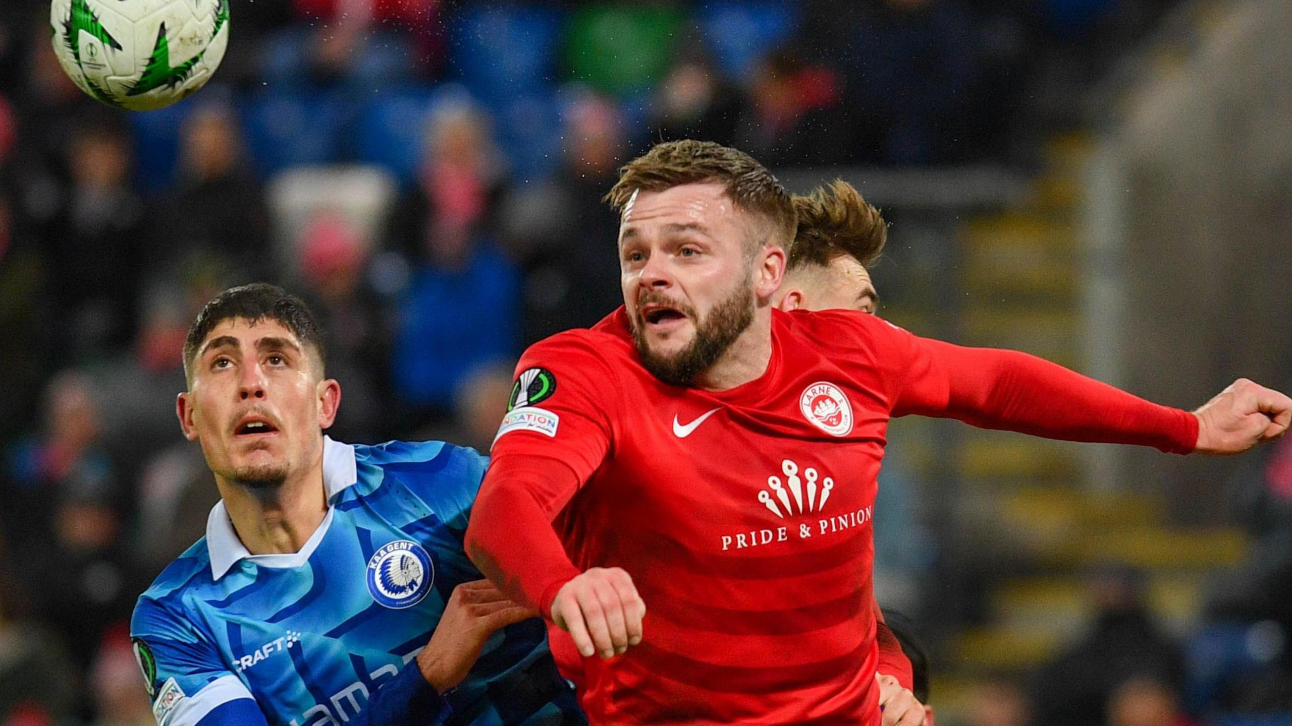 Larne's Andy Ryan rises for a high ball