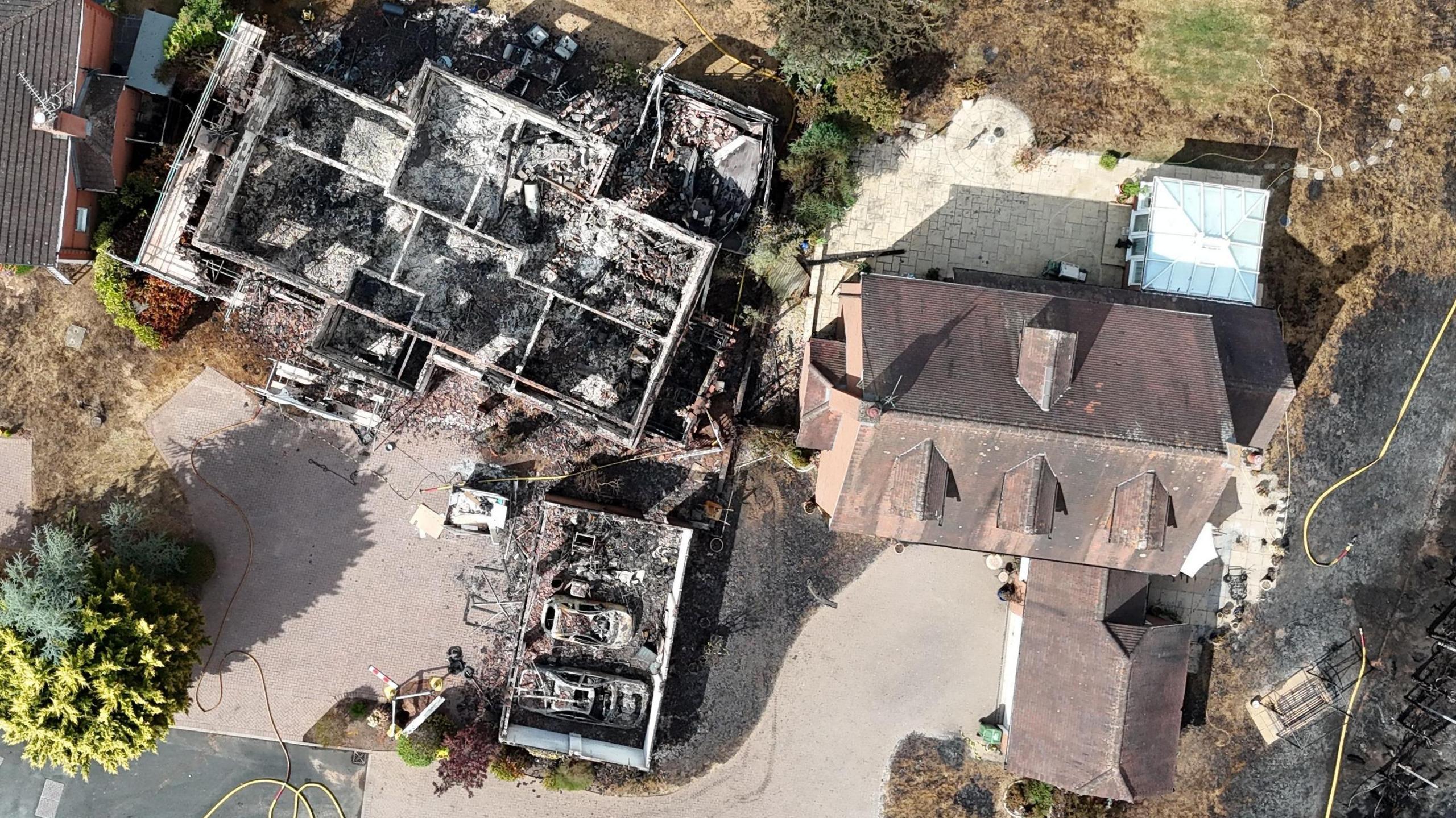 An aerial image taken with a drone of fire damaged properties in Stourbridge, Britain, 14 August 2026.