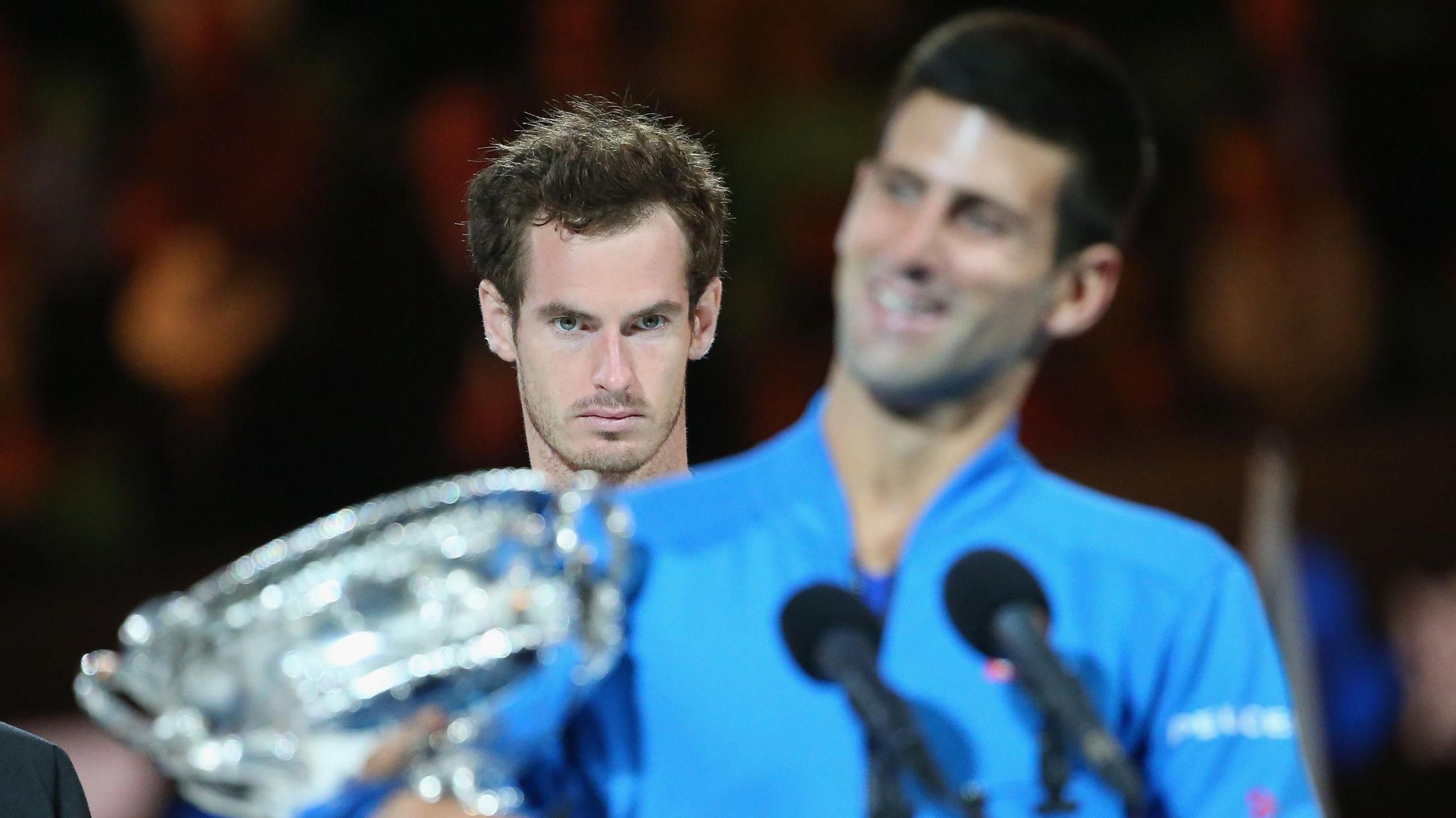 Andy Murray looks on as Novak Djokovic makes his winners' speech at the Australian Open