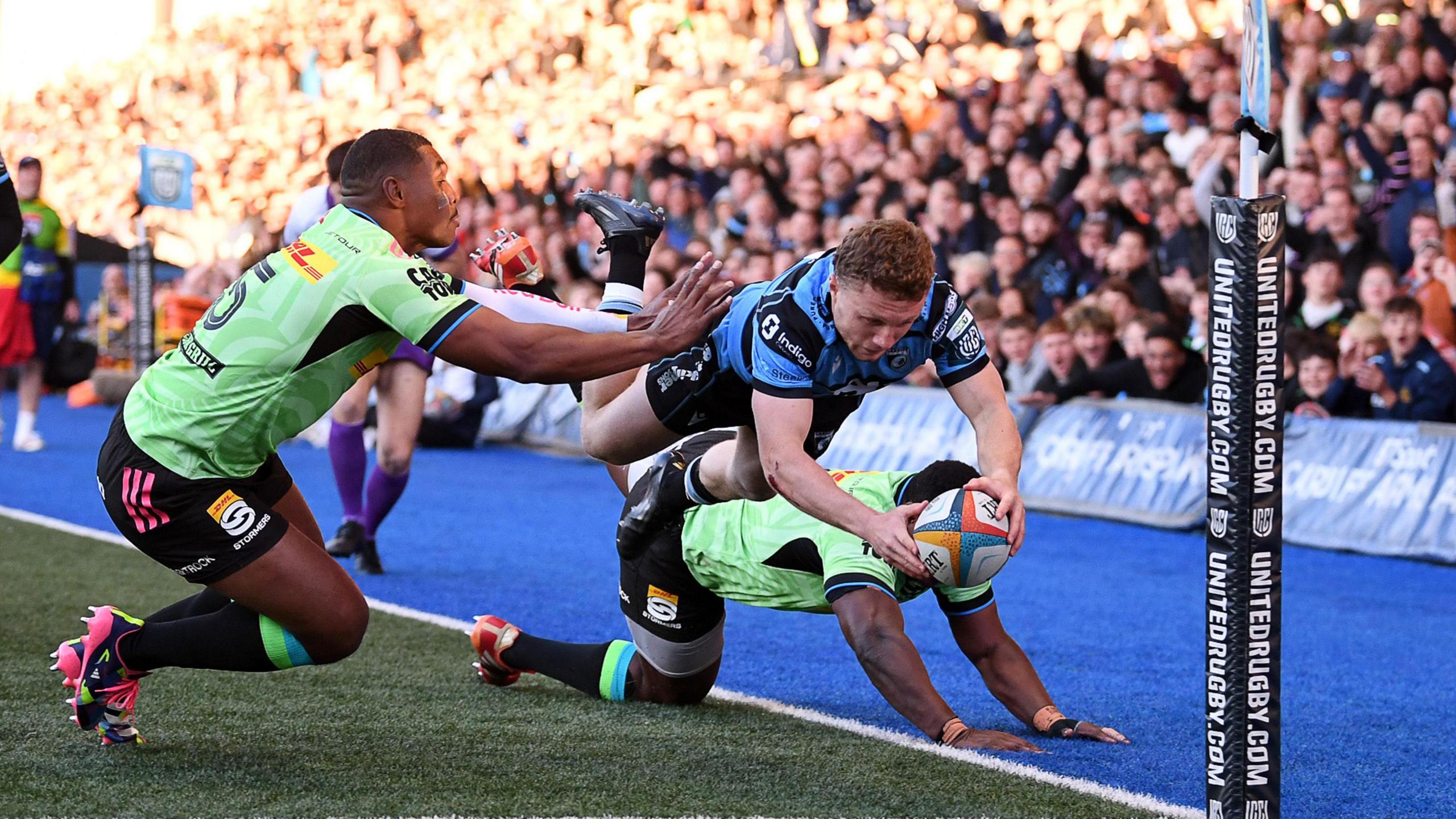 Cardiff wing Tom Bowen dives into score in the corner