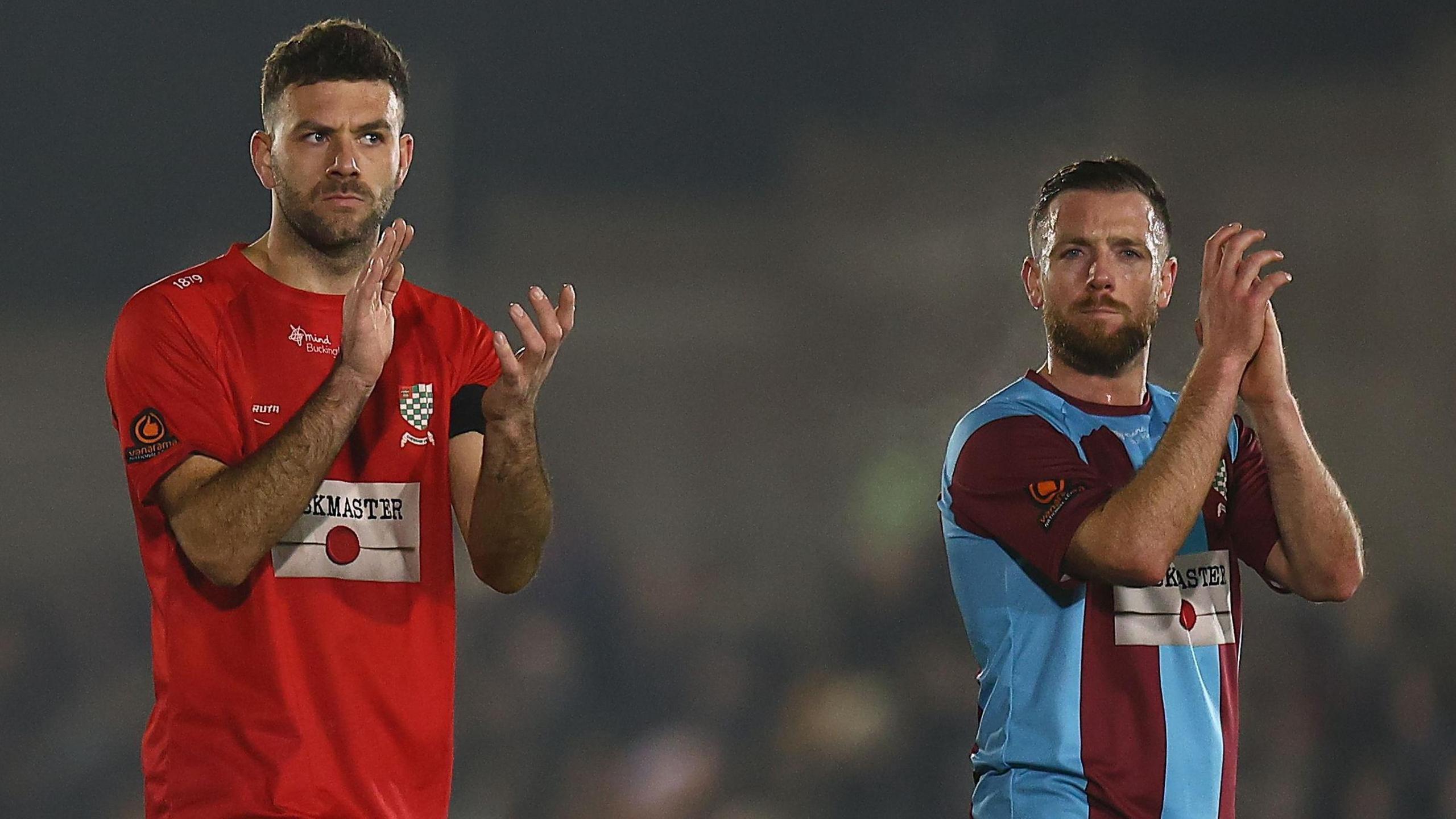 Chesham United players applaud their supporters following the FA Cup tie against Lincoln City