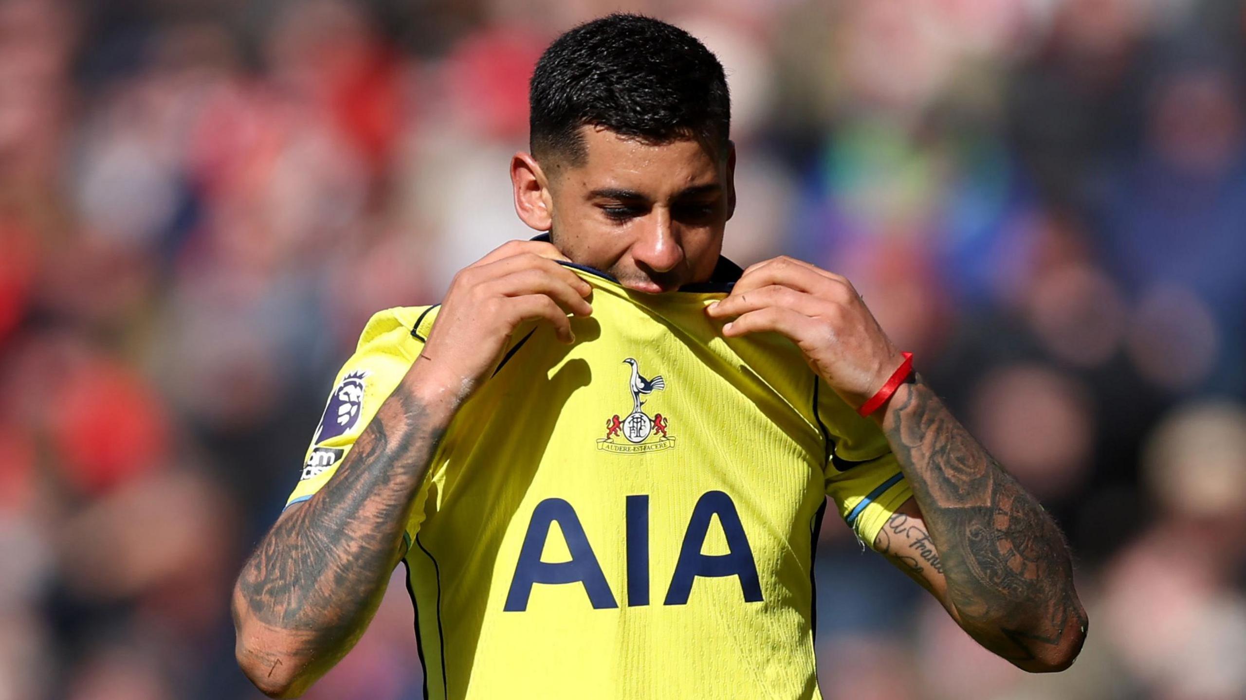 Tottenham's Cristian Romero bites his shirt as he is substituted in their Premier League game against Sunderland