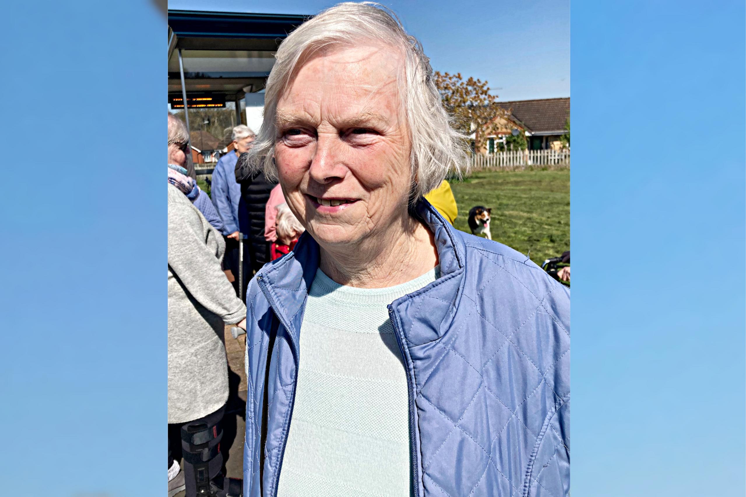 Linda Hunt standing by a bus stop in Ashton Vale in Bristol