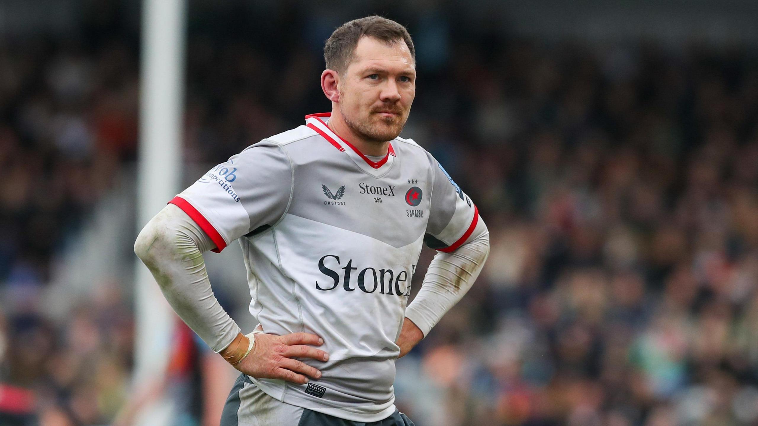 Alex Goode standing on the pitch during a Saracens game