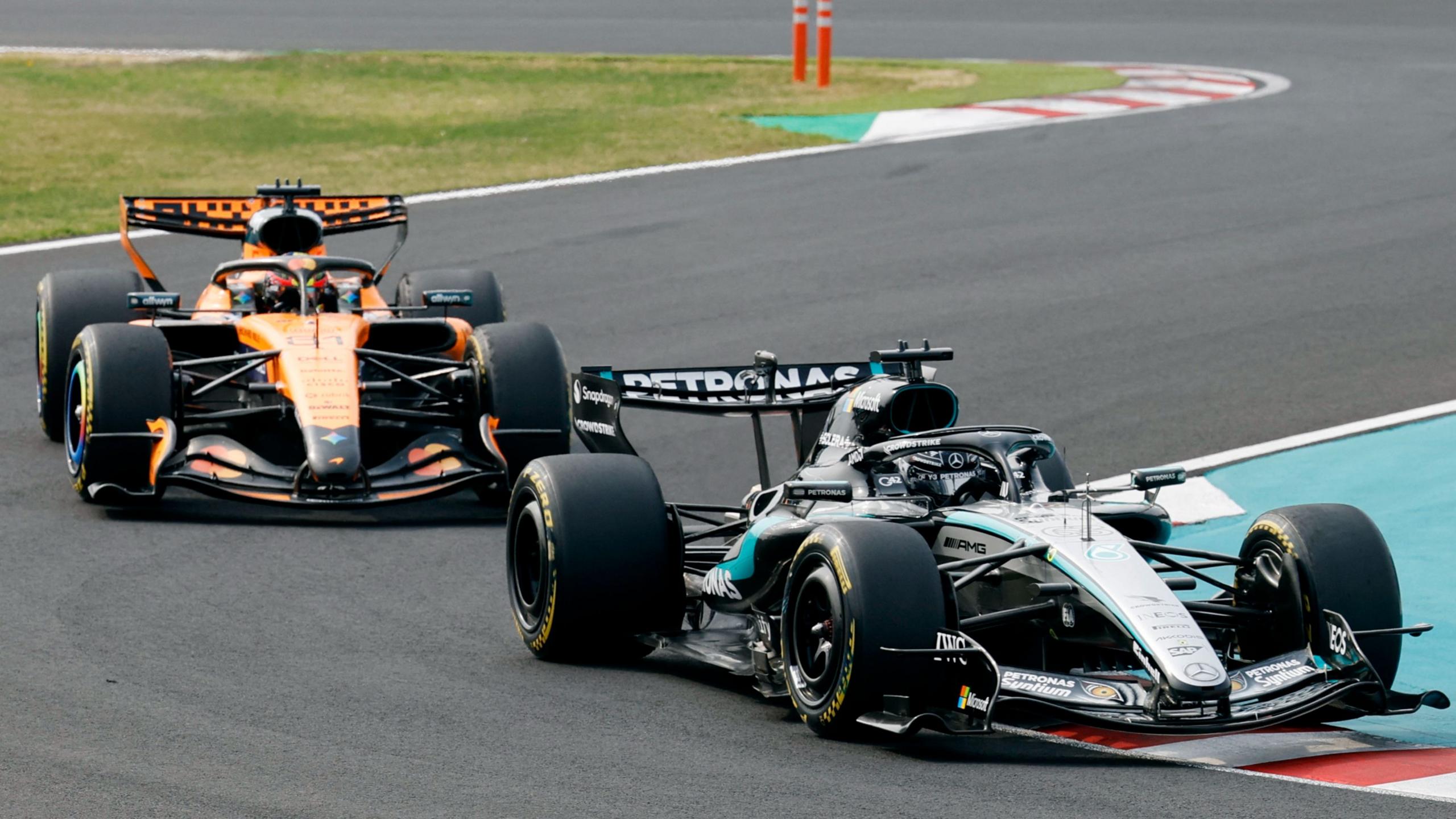Mercedes' George Russell leads McLaren's Oscar Piastri through the chicane at Suzuka during the Japanese Grand Prix