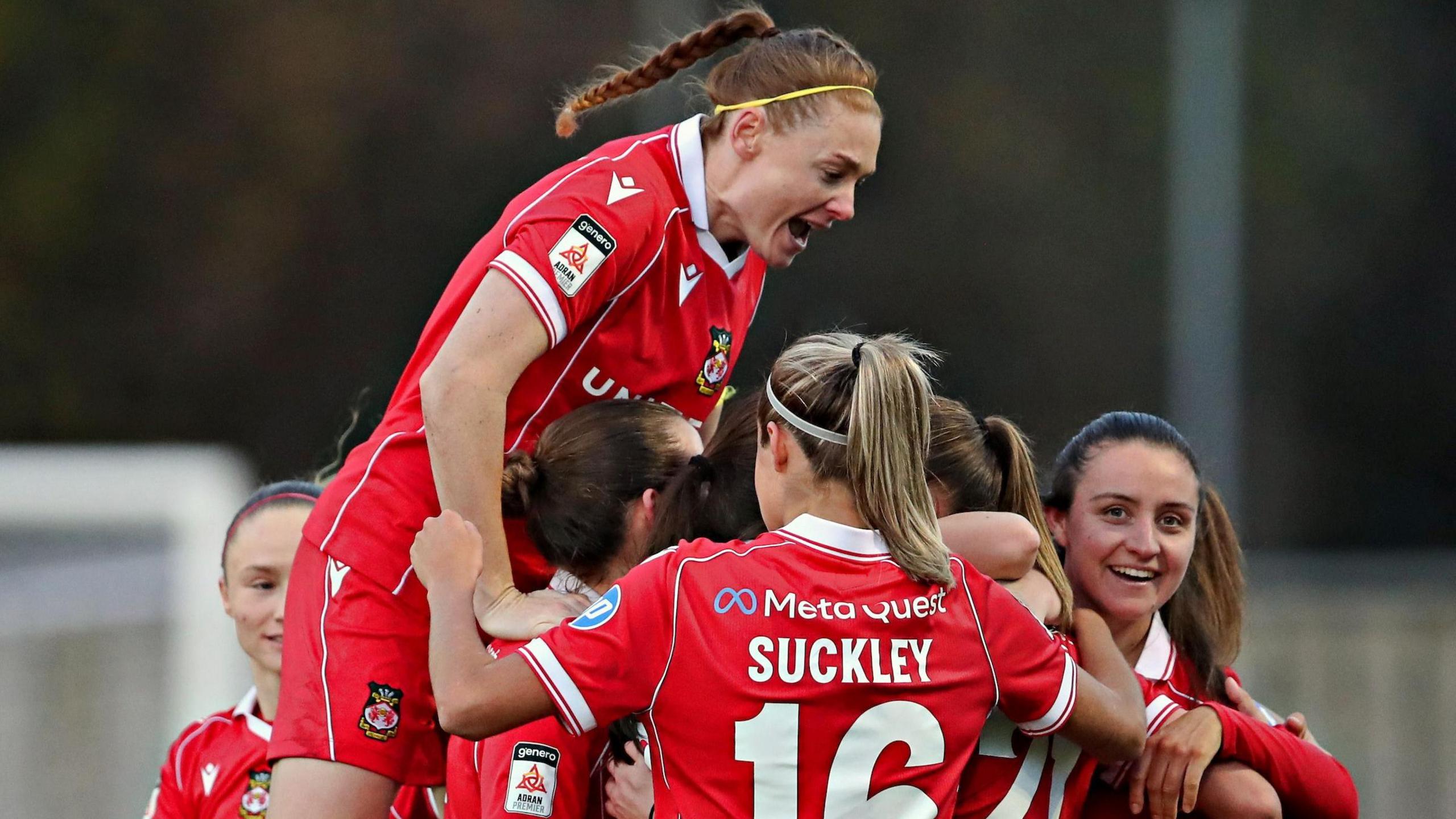 Wrexham players celebrate their third goal