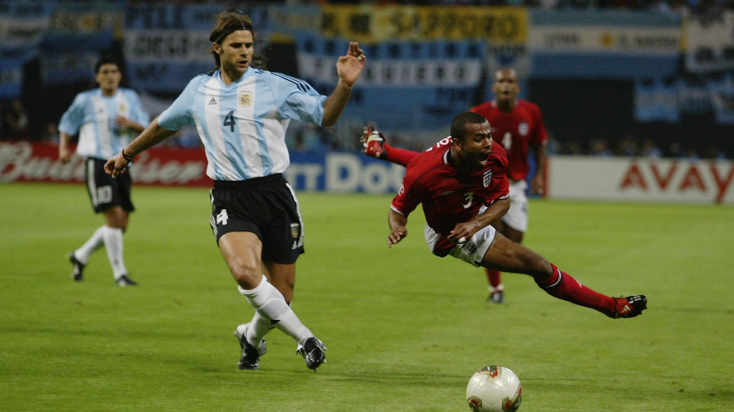 Argentina's Mauricio Pochettino tackles England's Ashley Cole at the 2002 World Cup