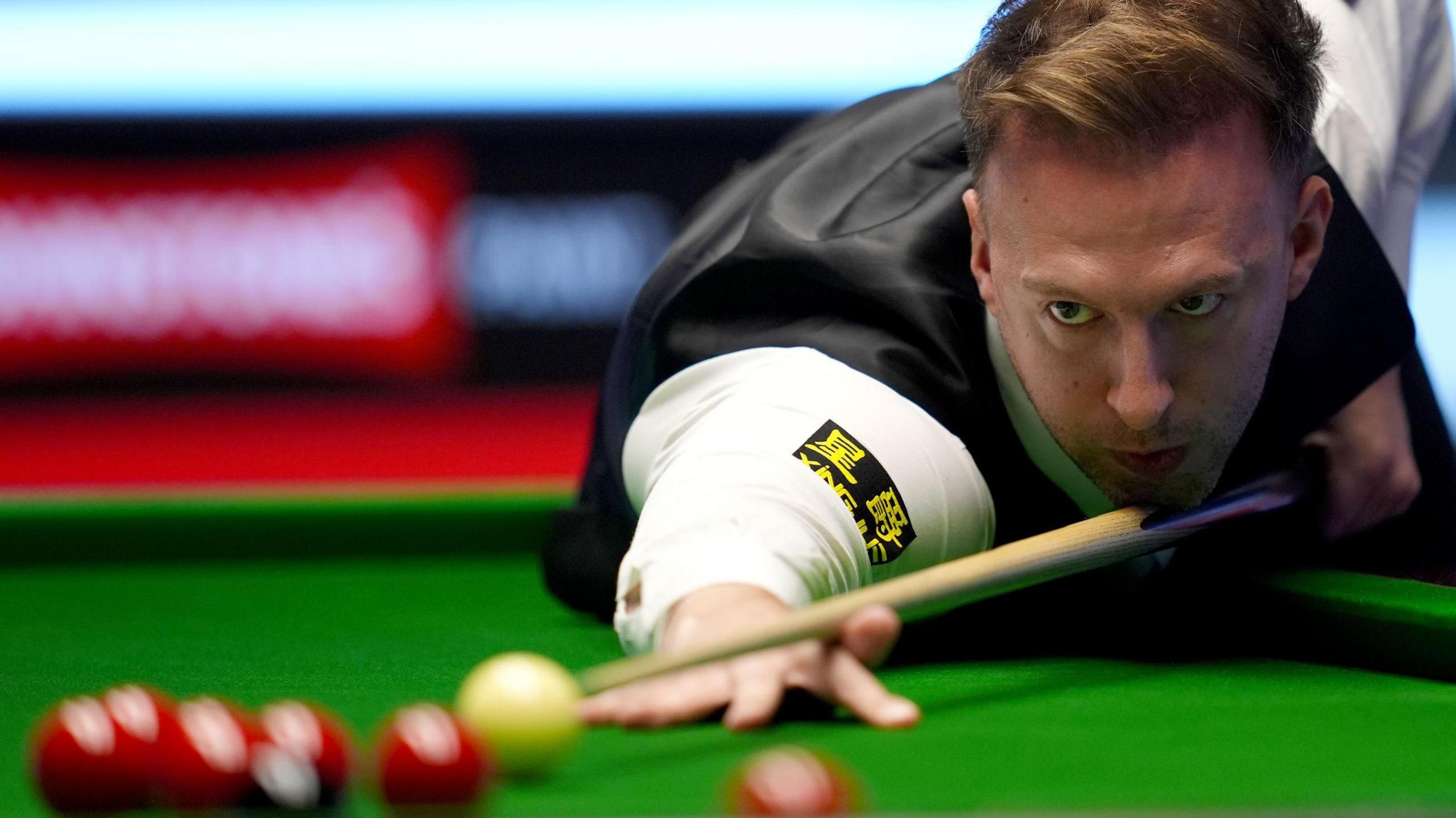 Judd Trump plays a shot at the Masters