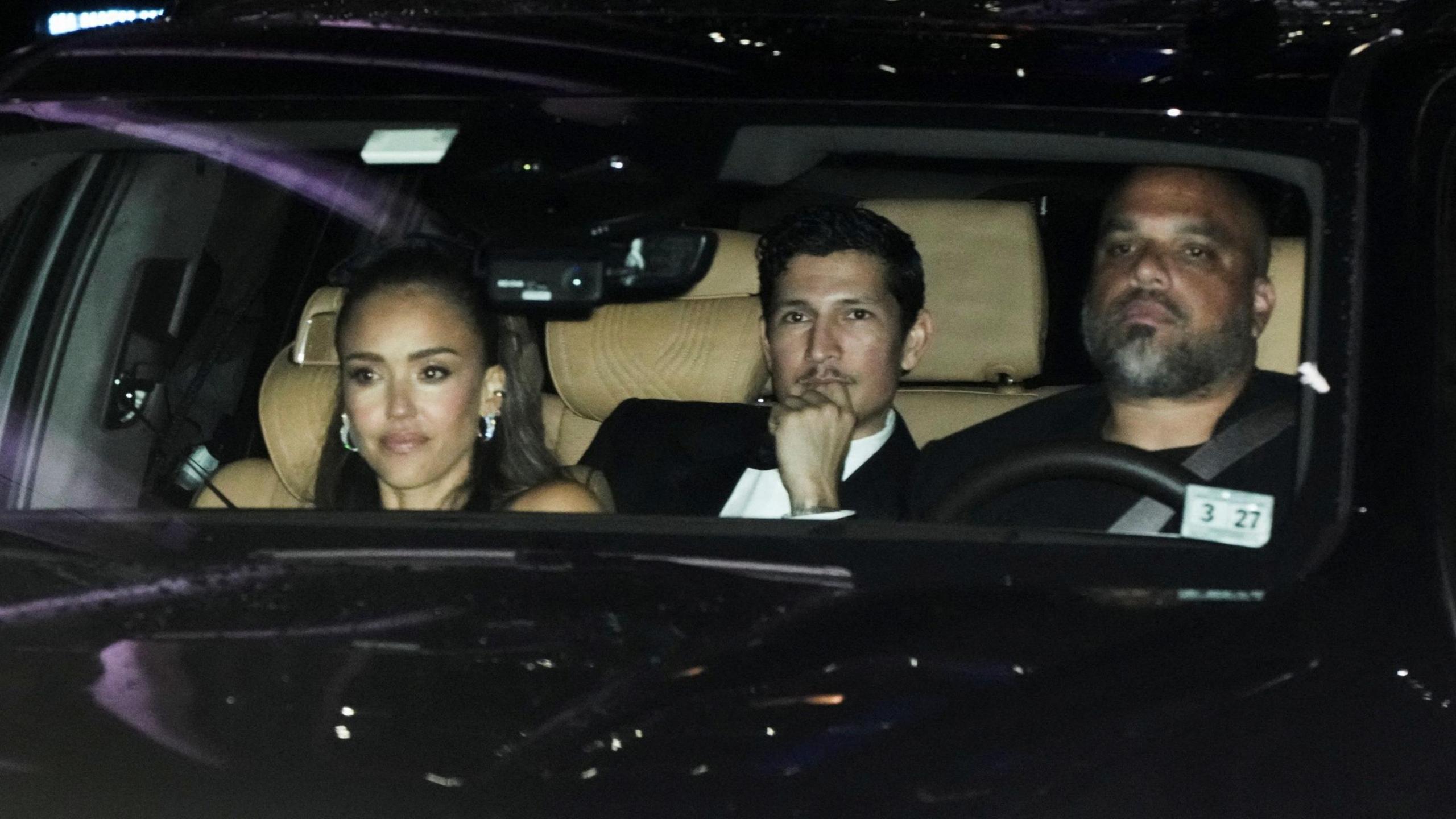 Jessica Alba and Danny Ramirez in a car leaving the event