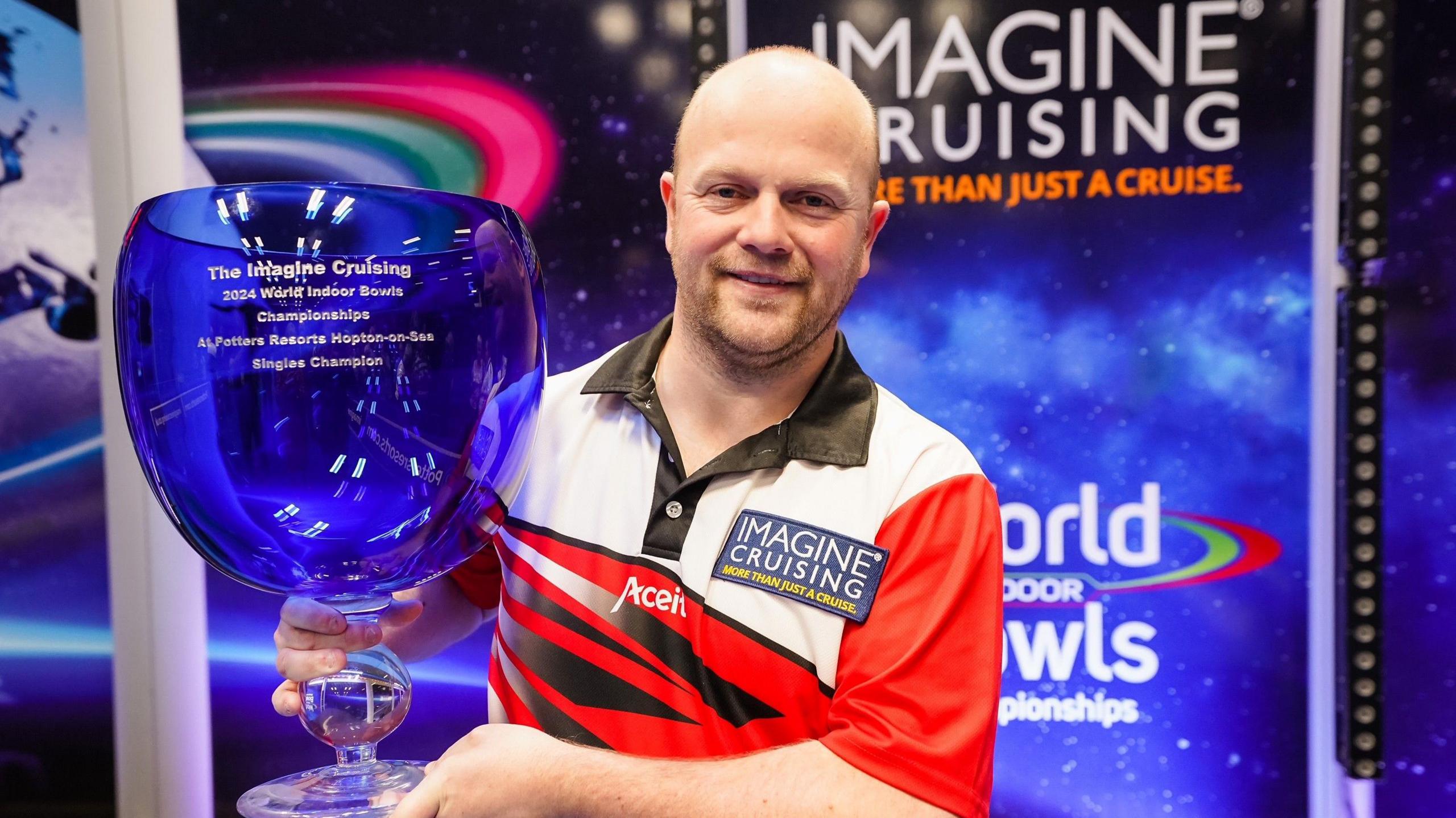 2024 winner Stewart Anderson from Scotland pictured with the trophy after winning his third World Indoor Bowls title