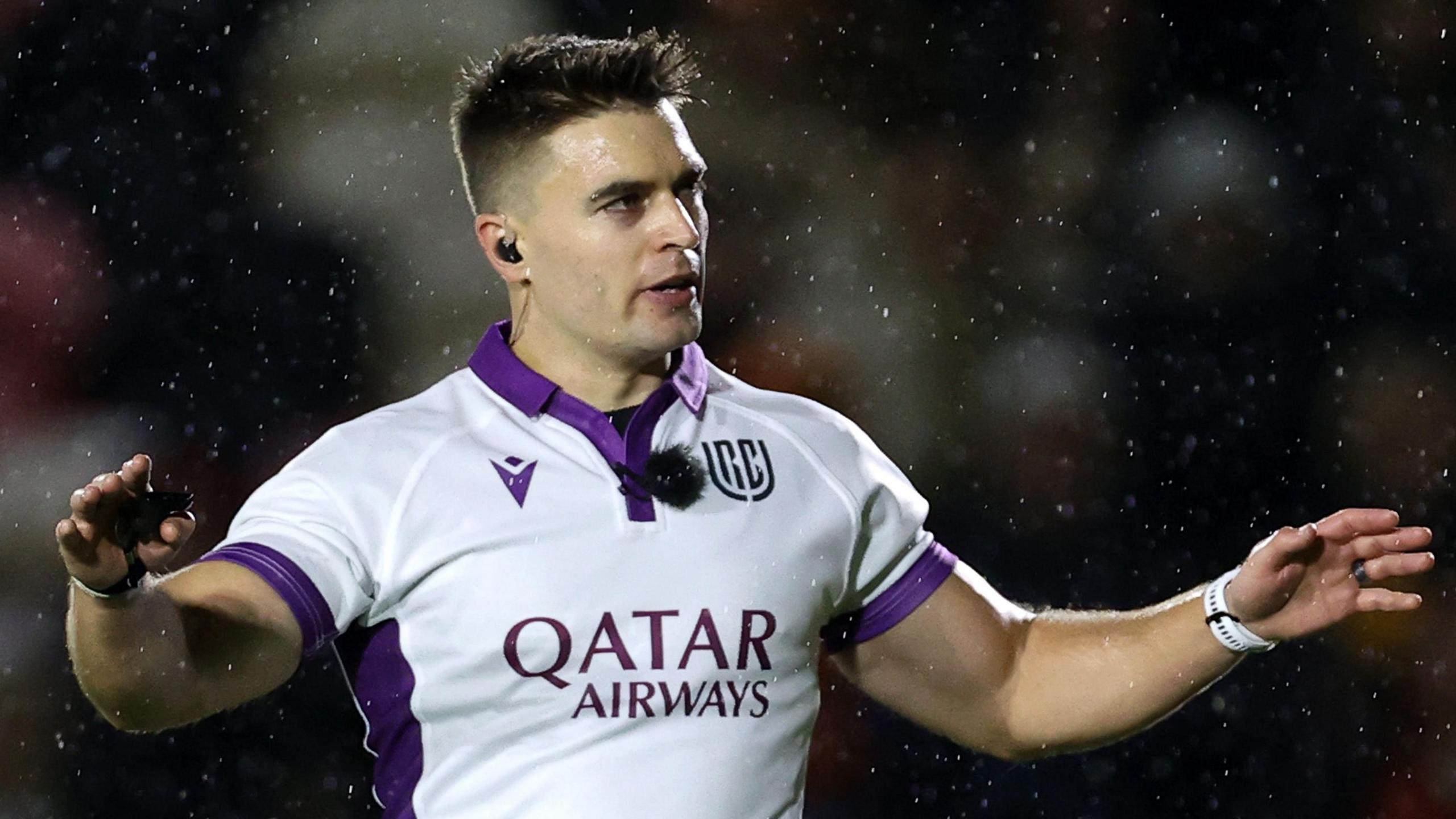South African referee Morne Ferreira calls for the TMO during the Dragons' game against Leinster