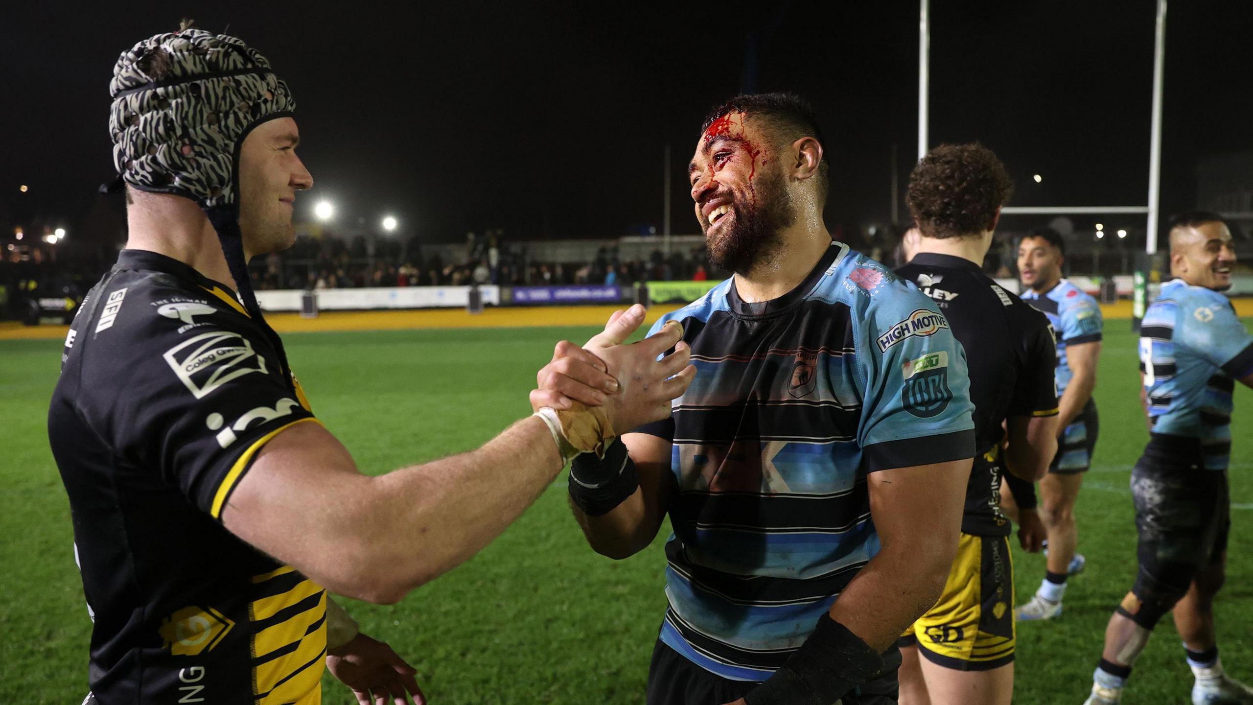 Dan Lydiate and Taulupe Faletau shake hands after the game