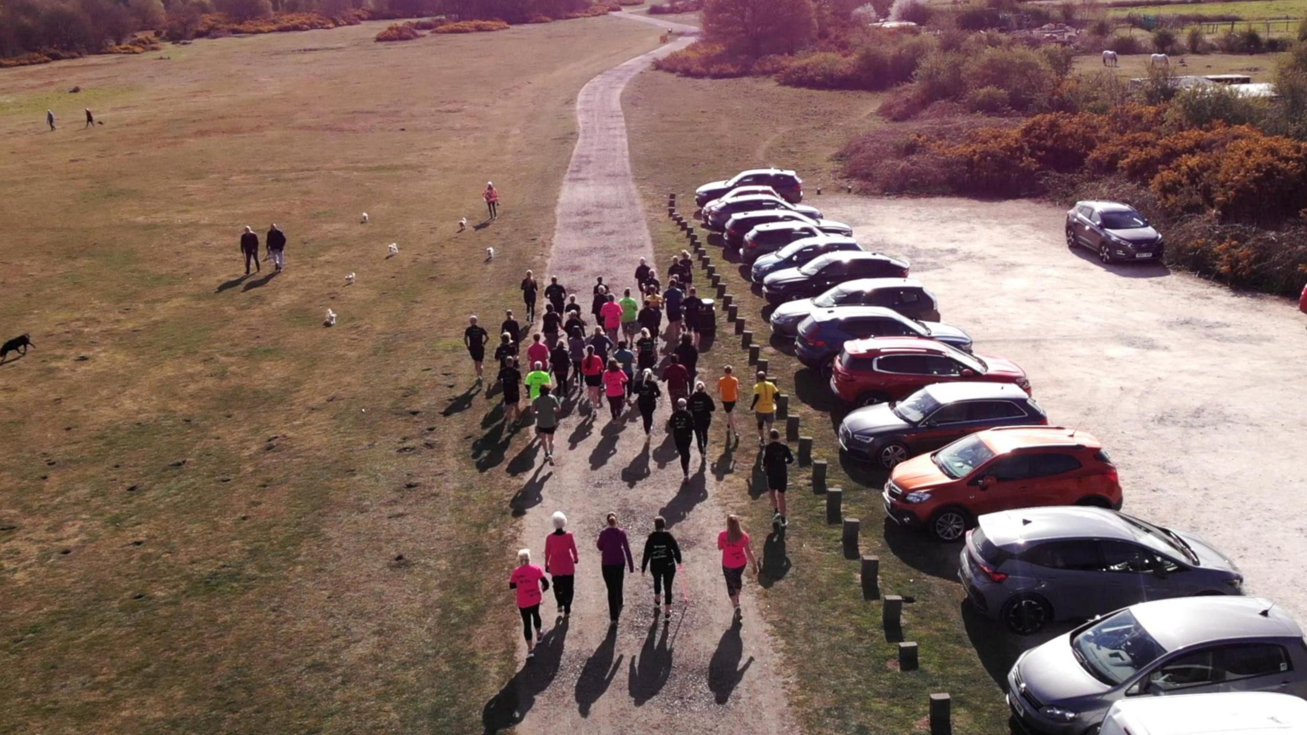 An aerial shot of the group, setting off. The "Together We Run" can be seen a few yards back from the Slow Sunday group.
