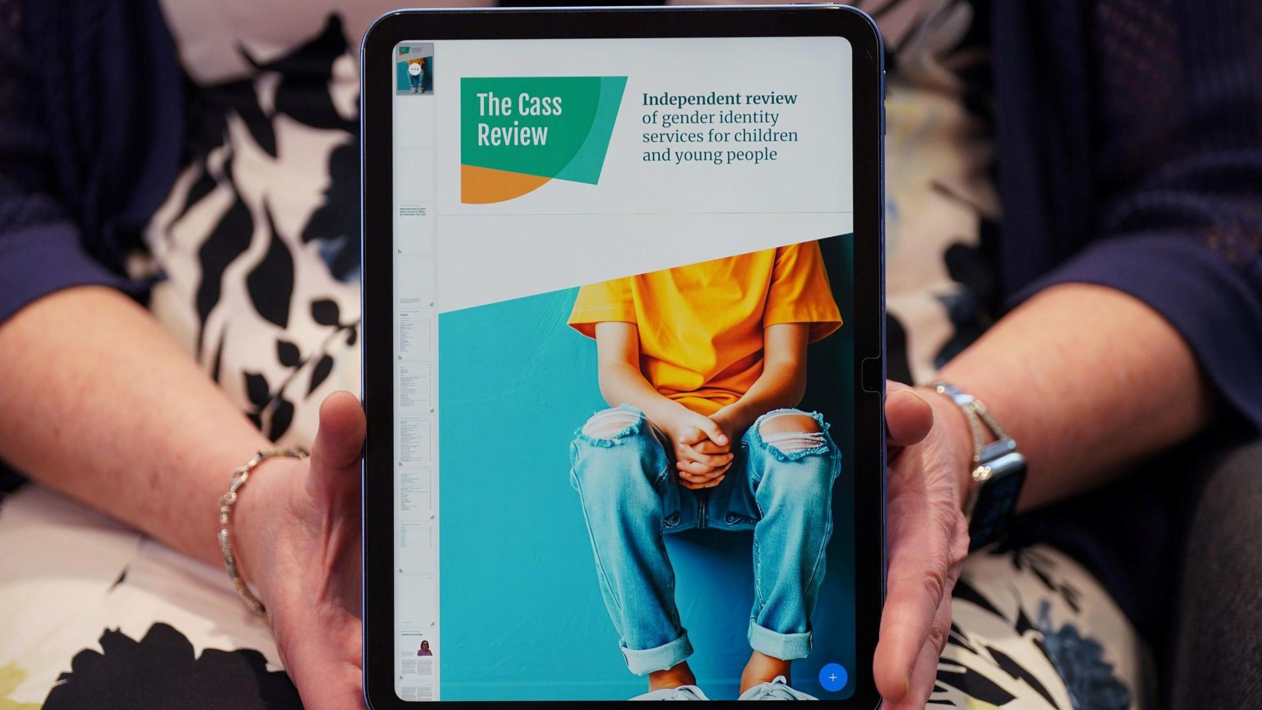 An image of the Cass Report held up on an ipad