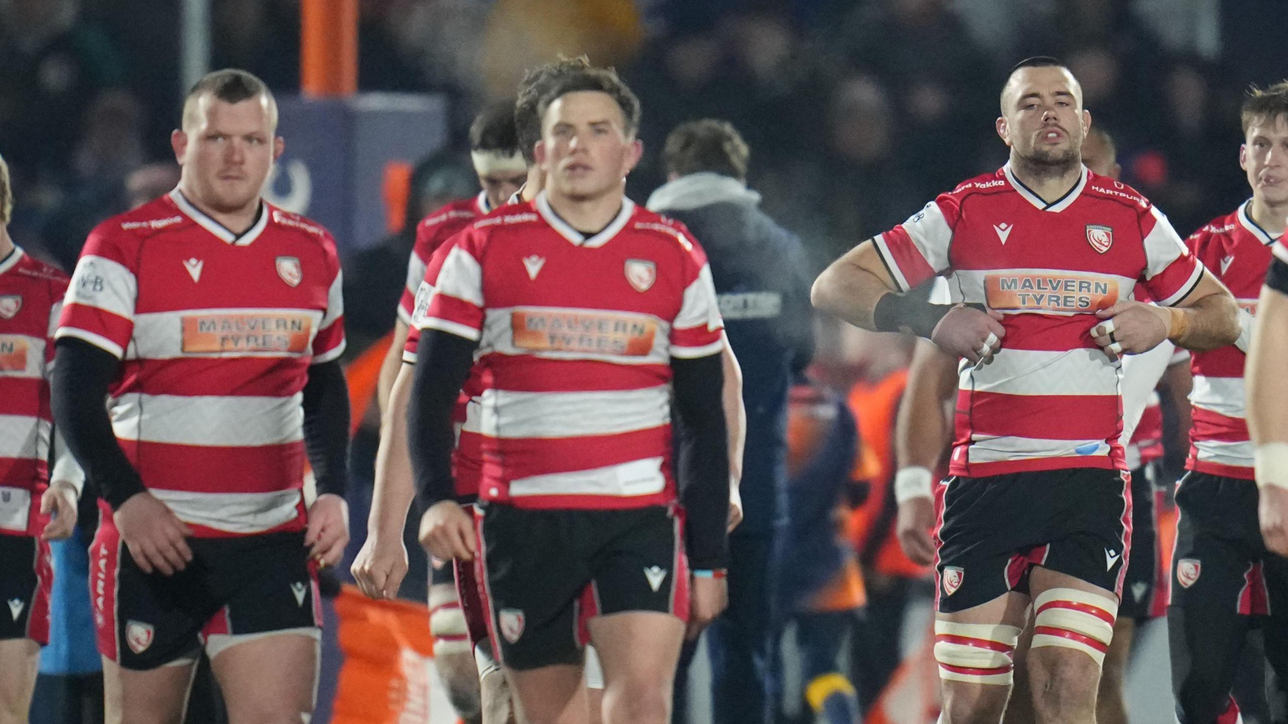 Will Crane (far left) walking on the pitch alongside Gloucester team-mates during their match against Edinburgh