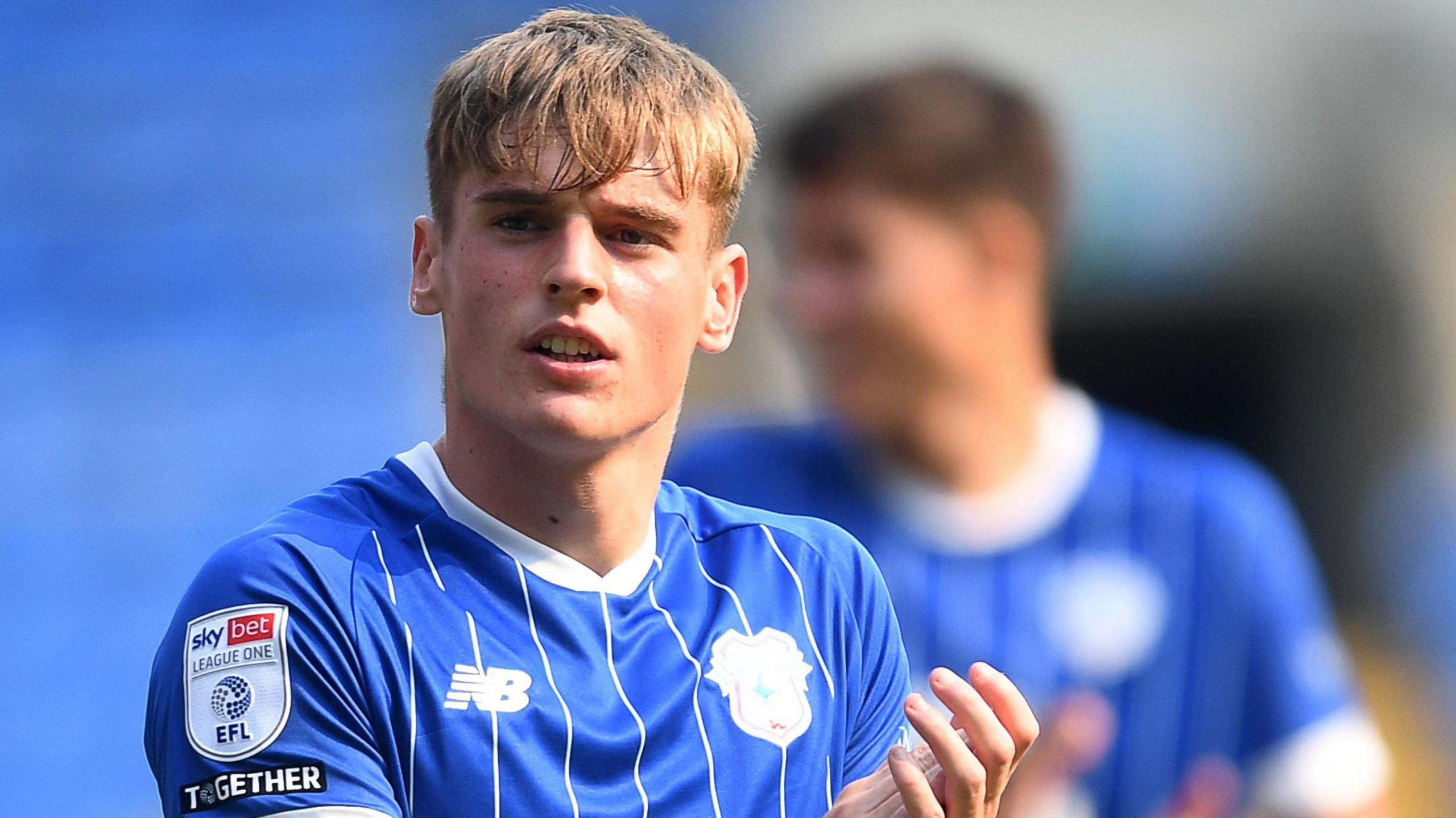 Defender Dylan Lawlor applauds fans aft Cardiff City's triumph complete Rotherham United