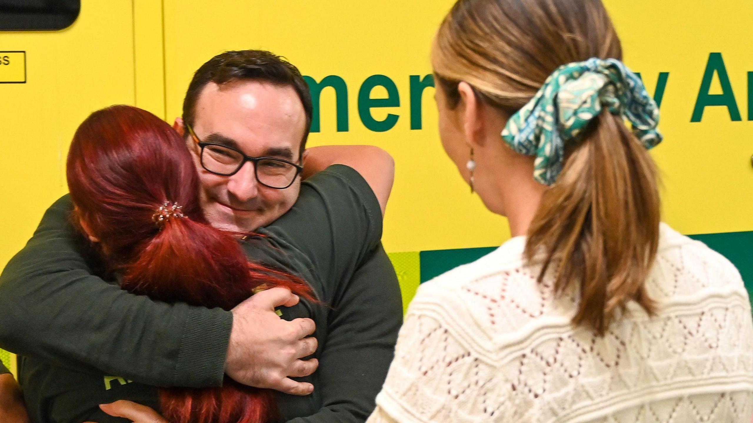 Patrick hugs paramedic Liz Keegan