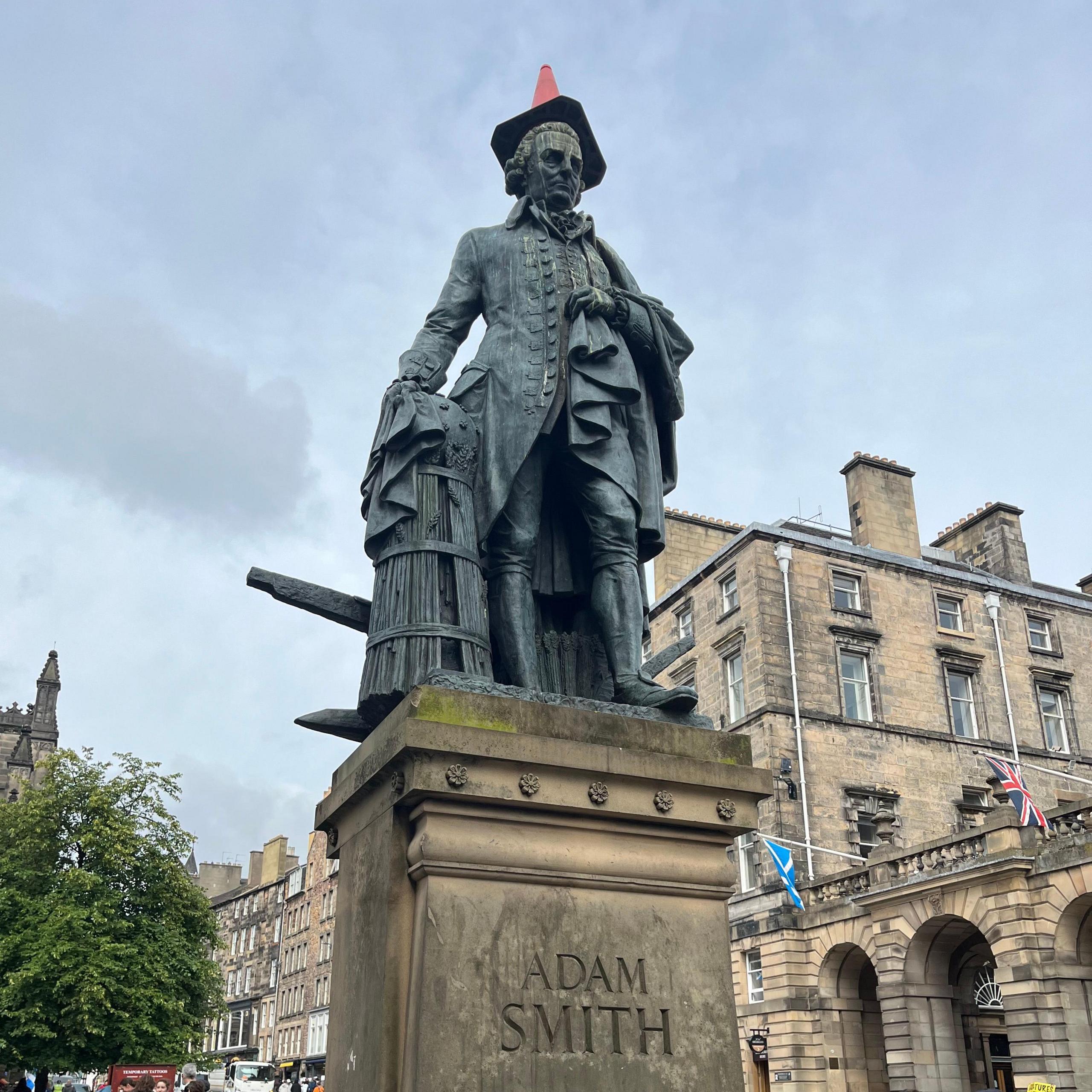 The Adam Smith statue on the Royal Mile with a cone on its head.