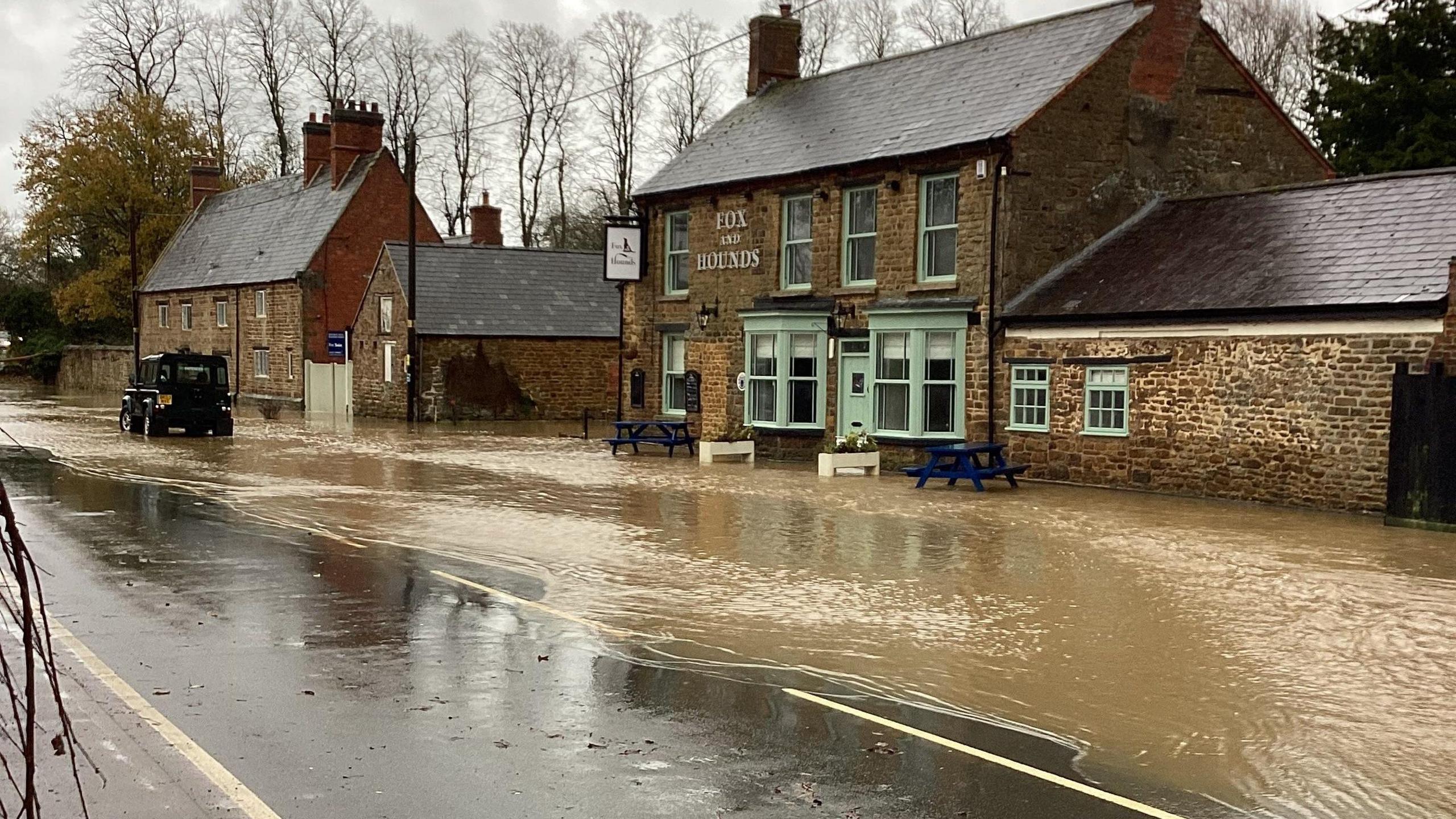 Flooding outside the Fox and Hounds pub