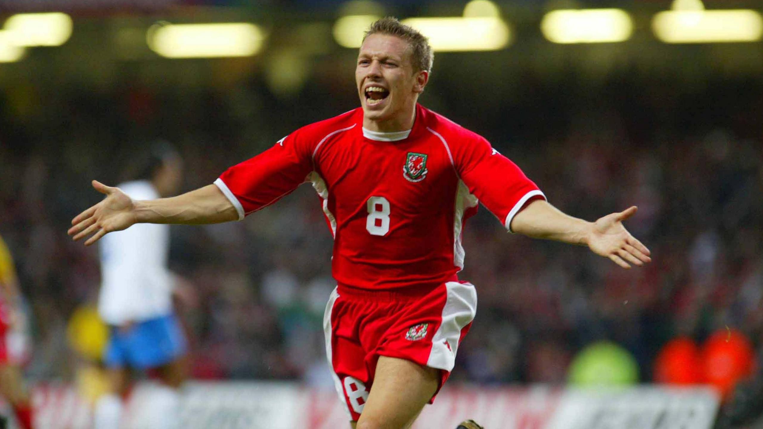 Craig Bellamy celebrates after scoring for Wales against Italy