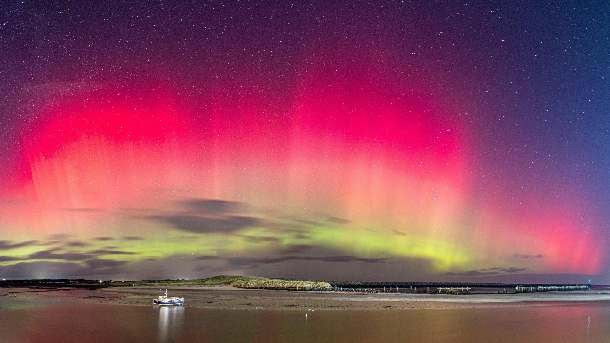 Red and green aurora light up skies above Northumberland 