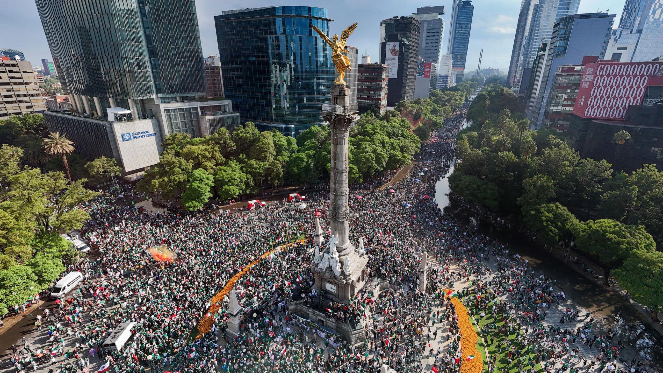 An aerial photo shows Mexico fans celebrating Mexico's victory over South Africa in the opening match of the FIFA World Cup 2026 at the Angel of Independence monument in Mexico City.