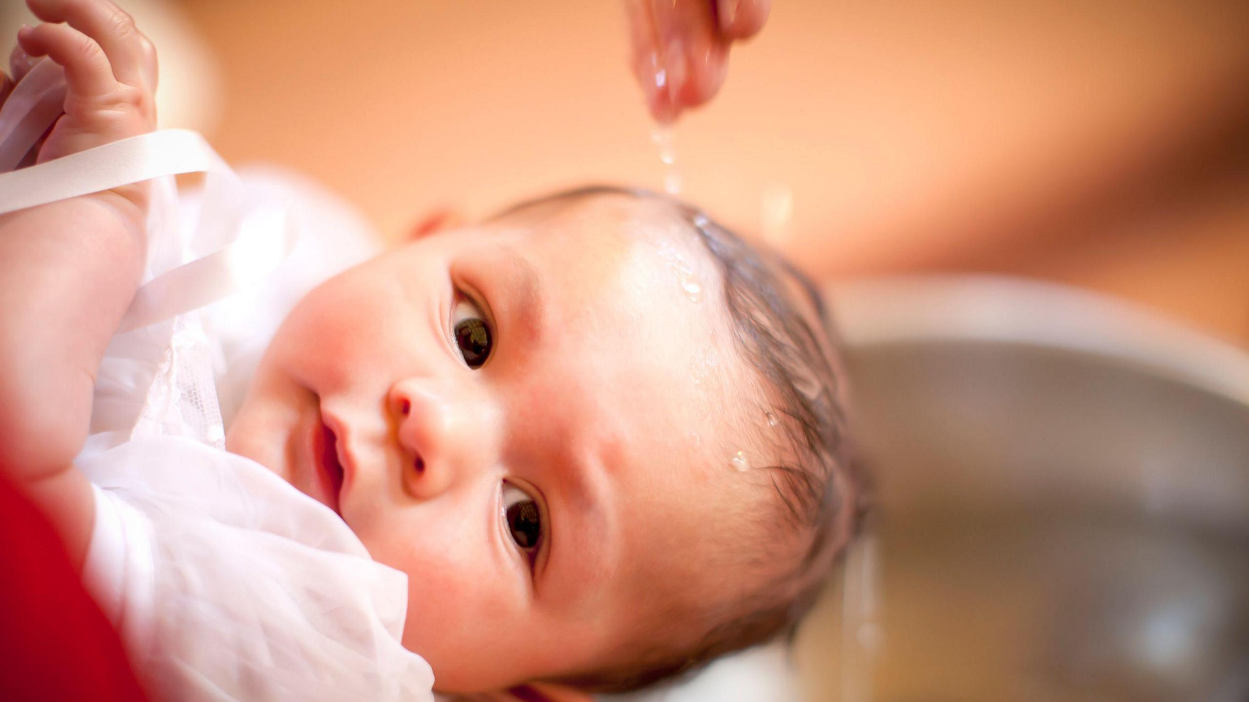 A 6 month old baby boy is baptized