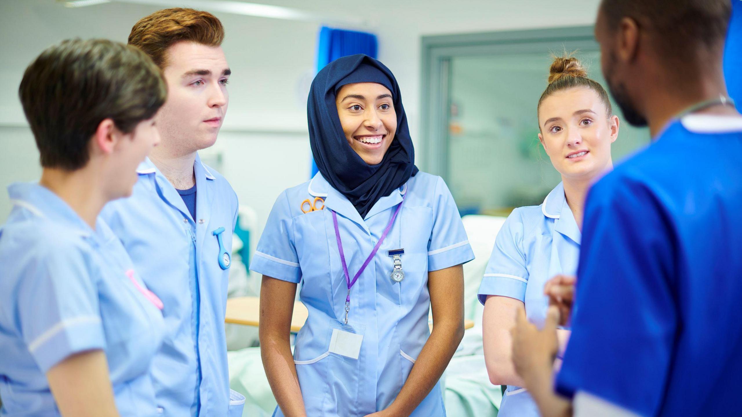 Nursing students chatting to each other