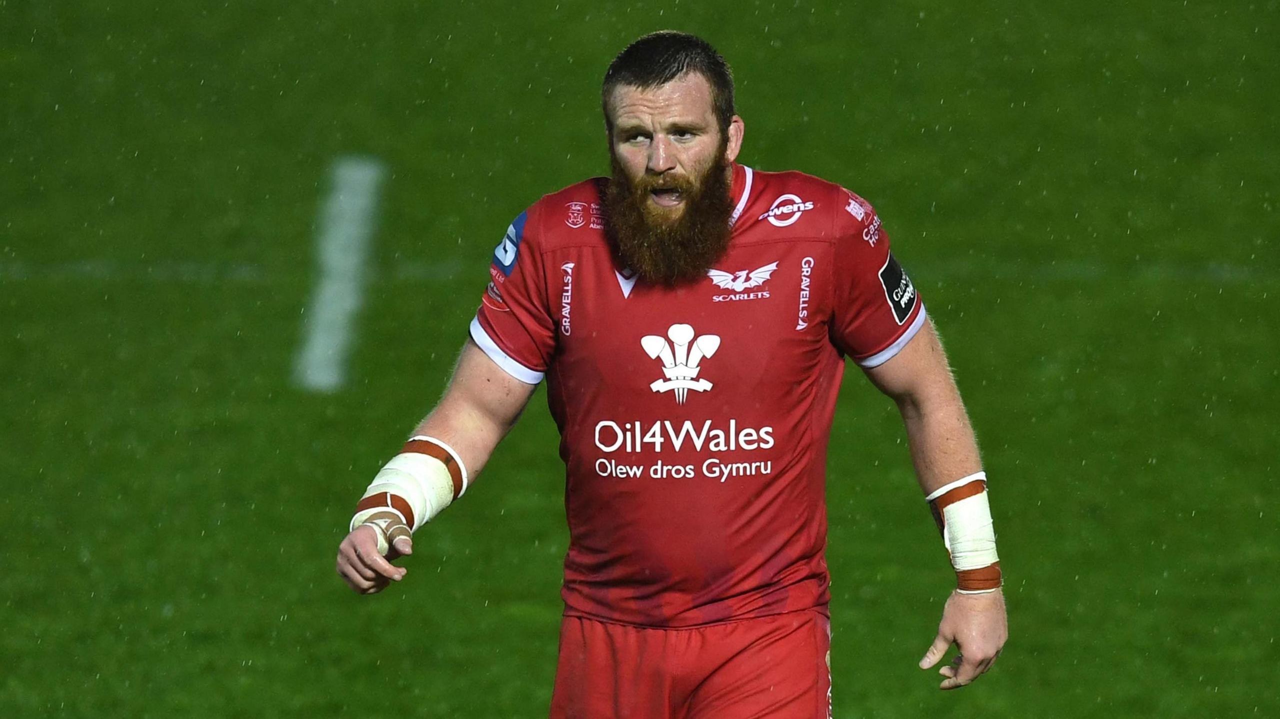 Jake Ball walks to a line-out for the Scarlets