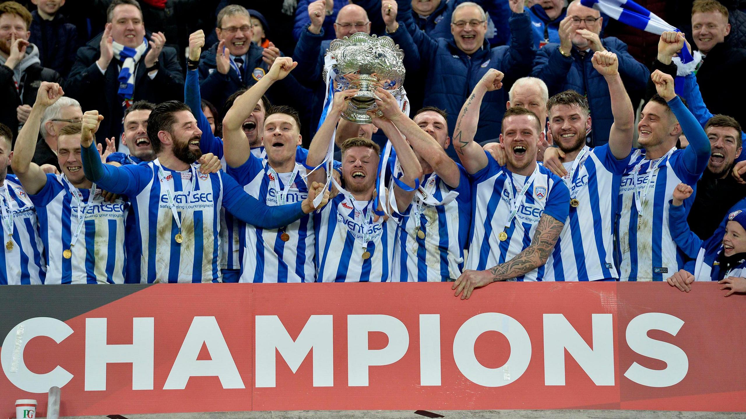 Lyndon Kane lifts the League Cup