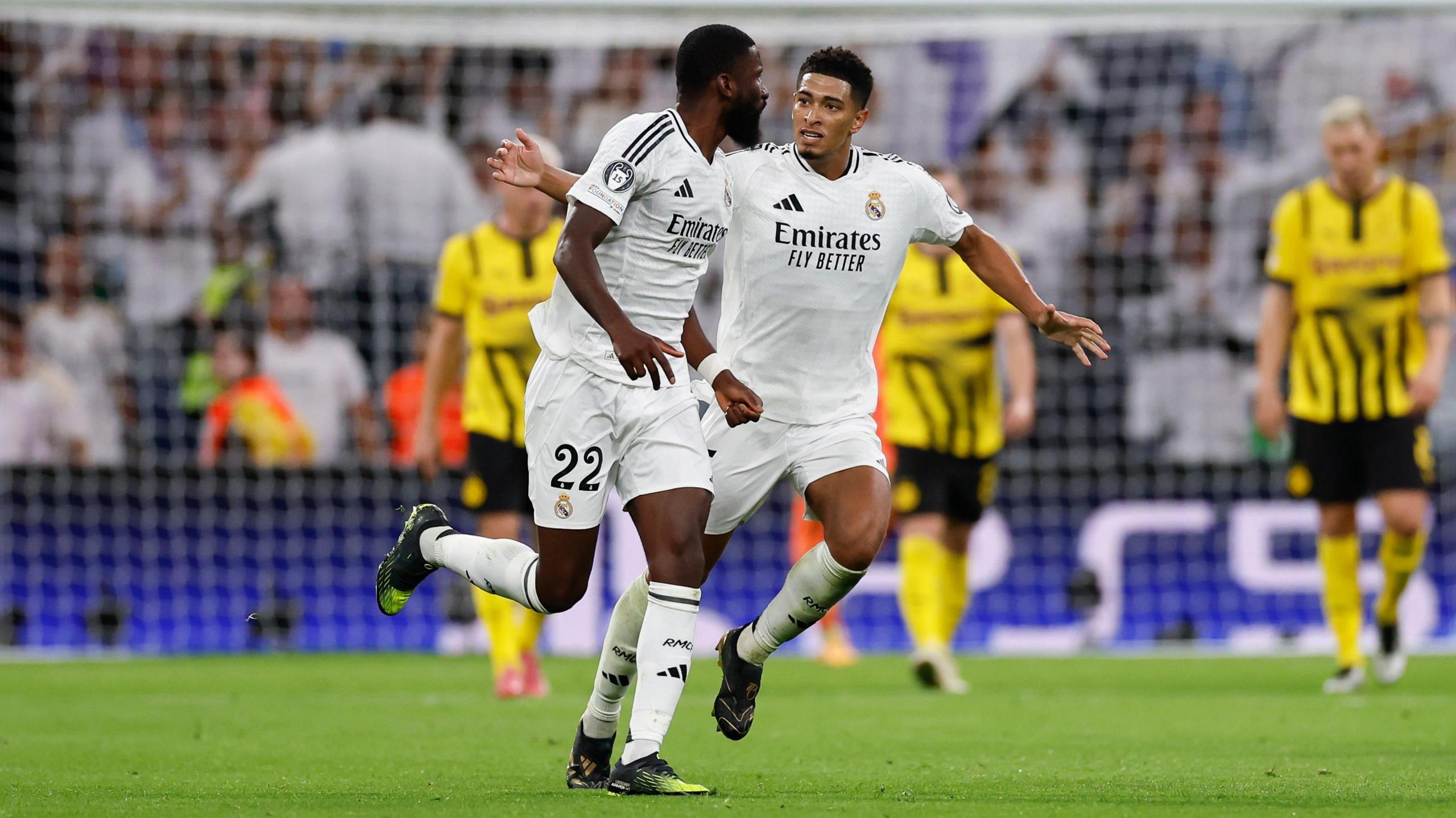 Jude Bellingham pats Antonio Rudiger on the back