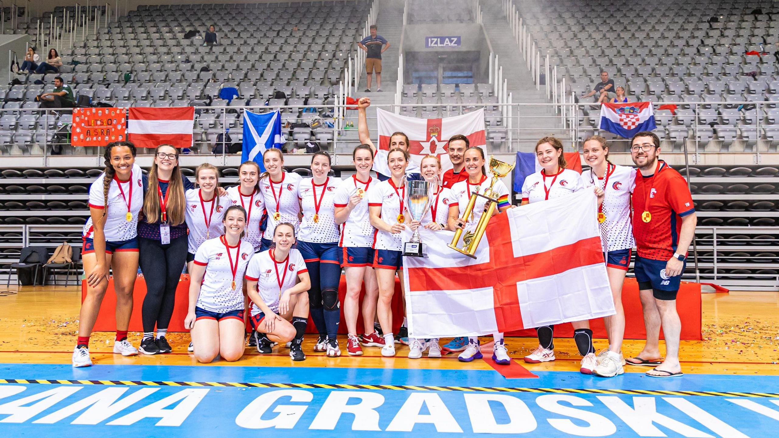 A dodgeball team with a trophy