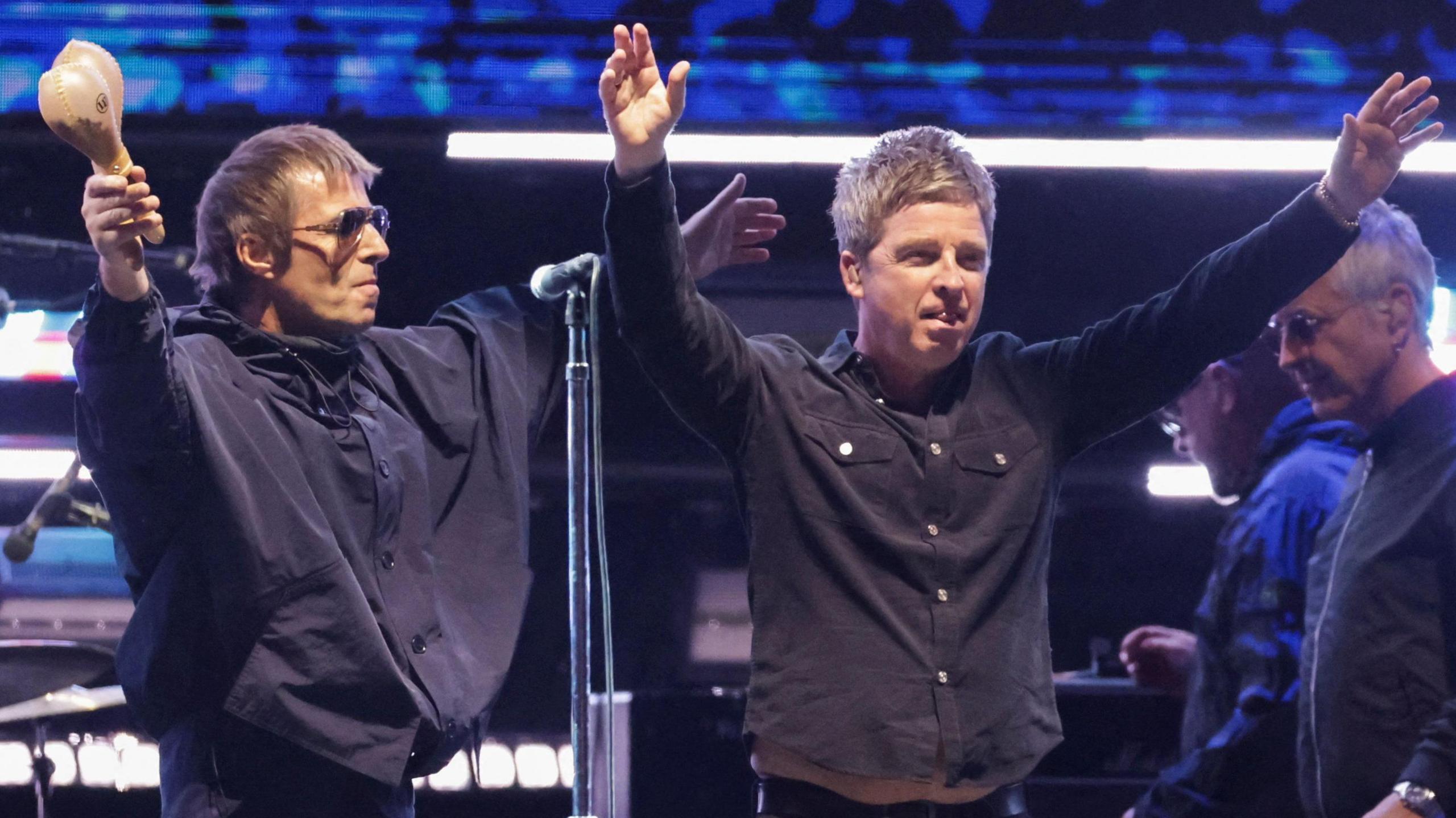 Liam and Noel Gallagher of Oasis performing live