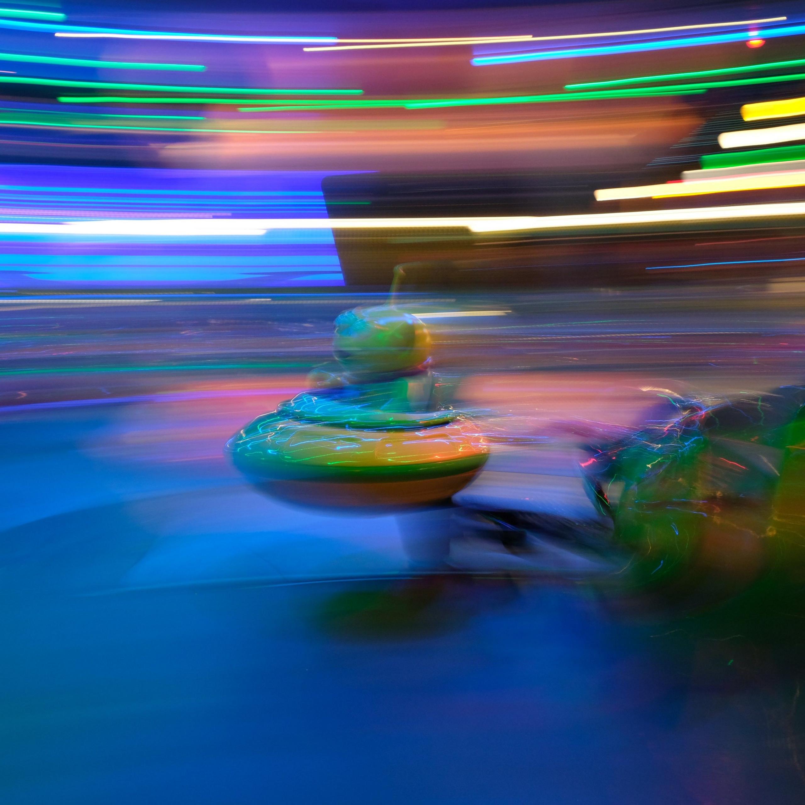 An alien figure on a fairground ride