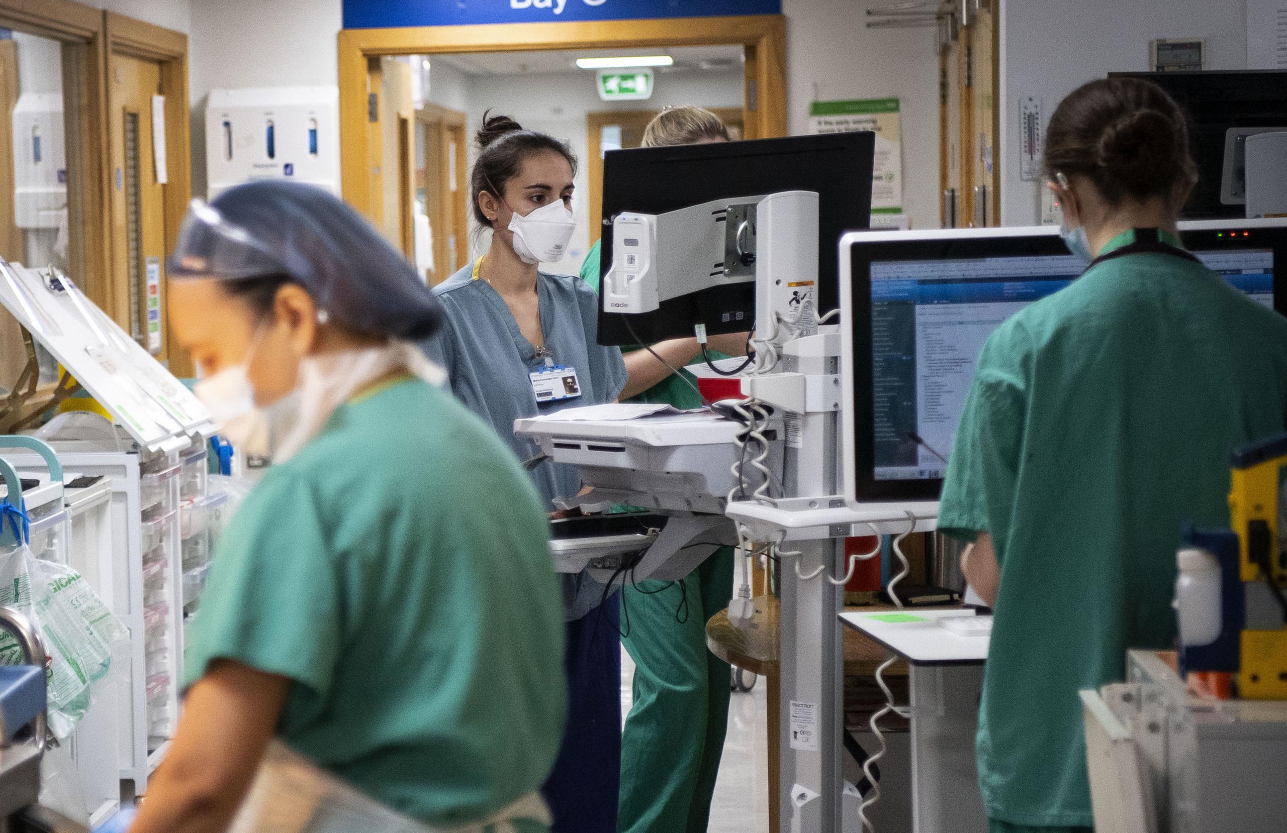 Staff nurses working in the corridor