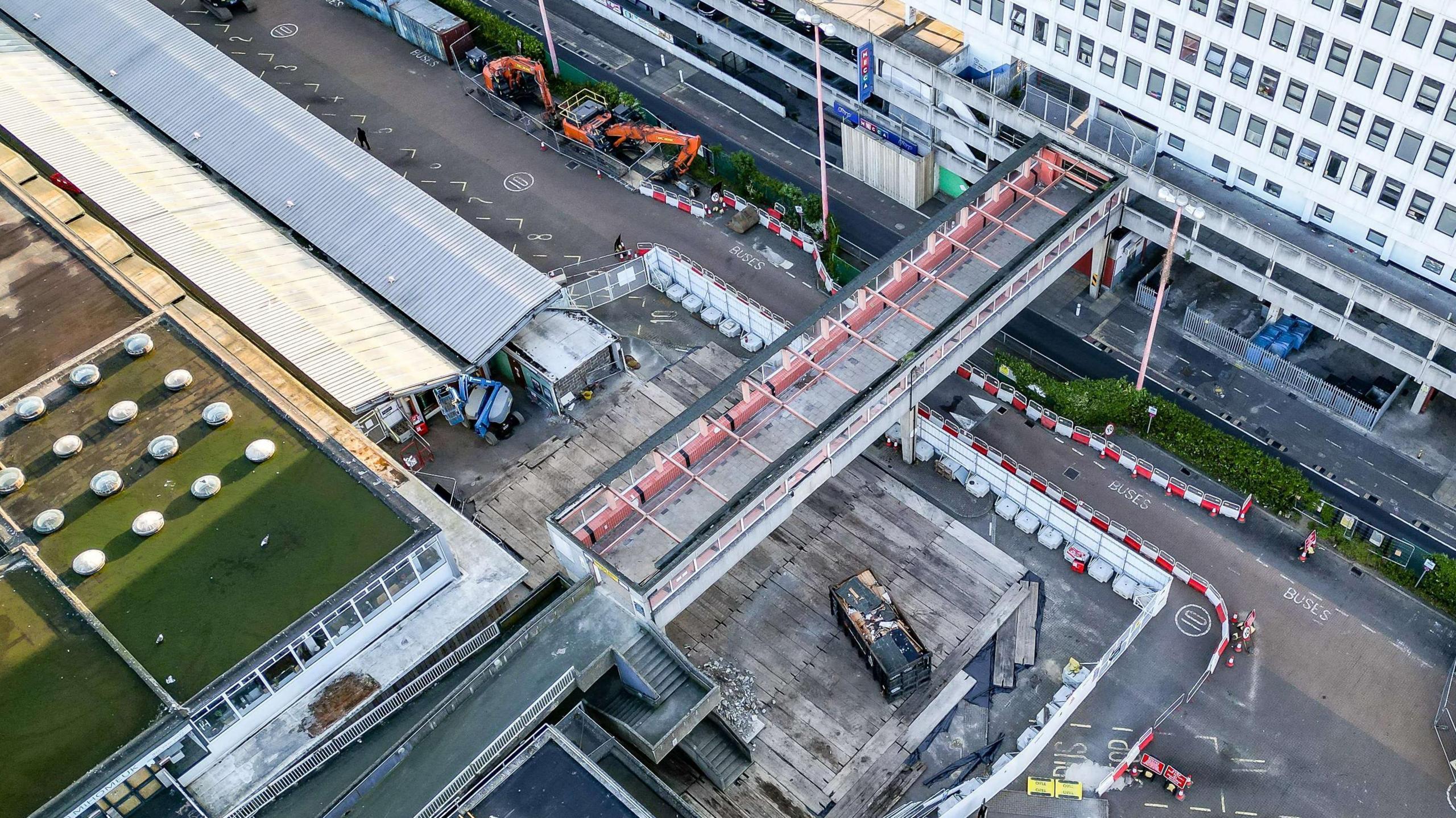 Aerial view of the 1968 footbridge linking a former office block to a carpark and shops in Harlow