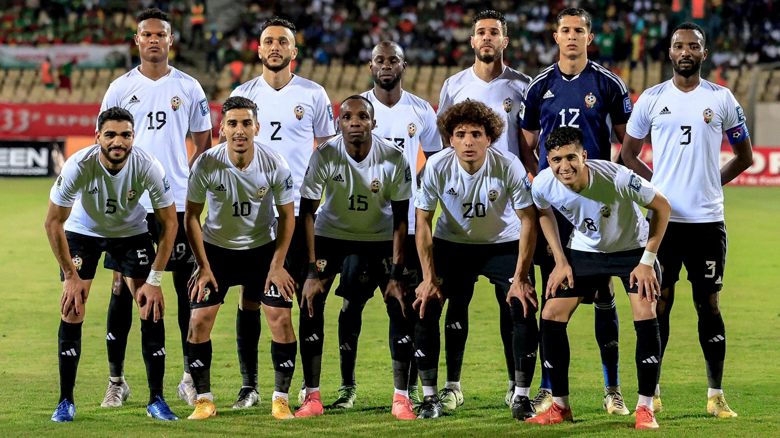 Libya's starting XI pose for a team shot on the pitch ahead of a 2026 World Cup qualifier against Cameroon in March