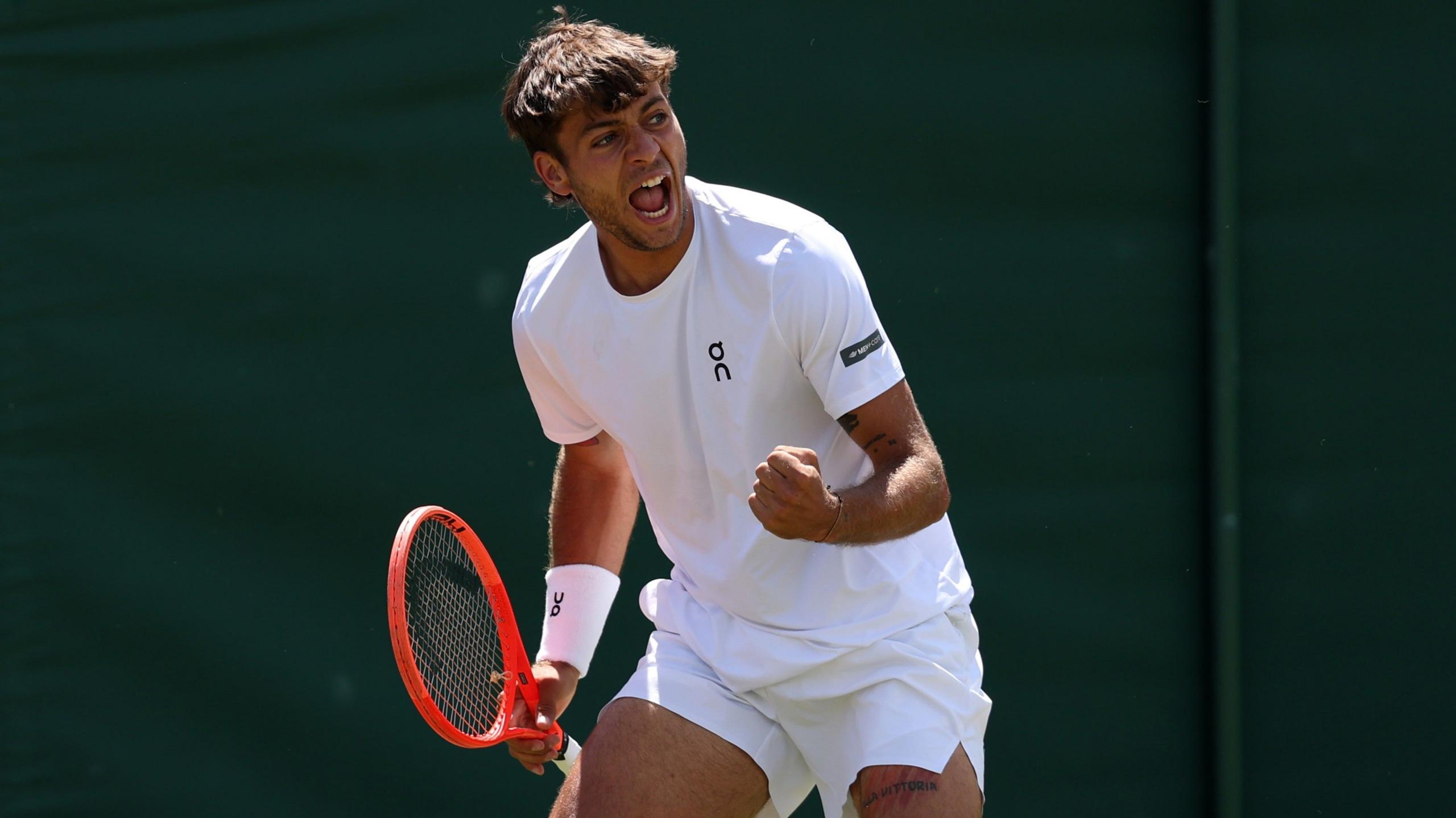 Flavio Cabolli celebrates during his straight-sets fourth-round win over Marin Cilic on court two at Wimbledon