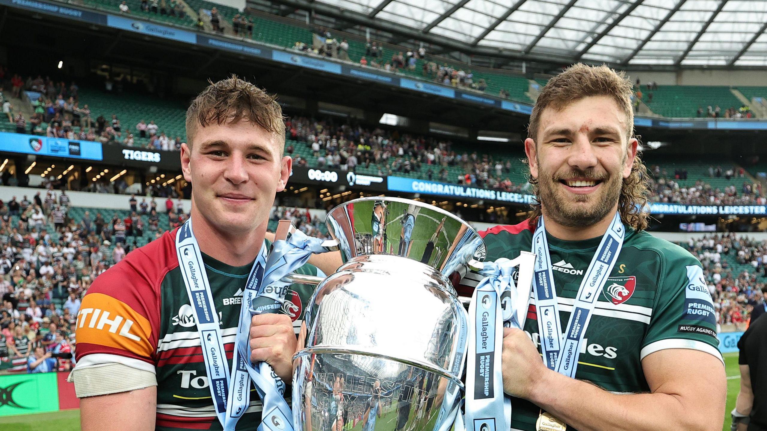 Harry Wells holds the Premiership trophy at Twickenham in 2022