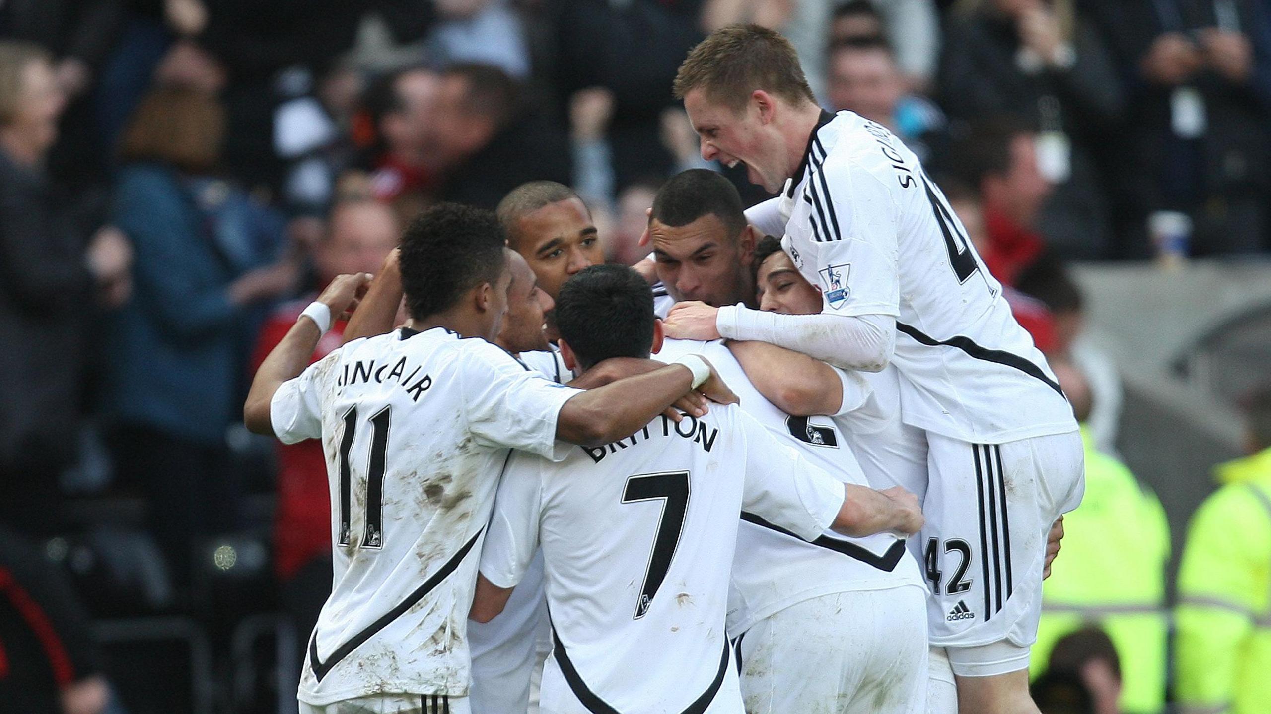 Swansea players celebrate Luke Moore's goal