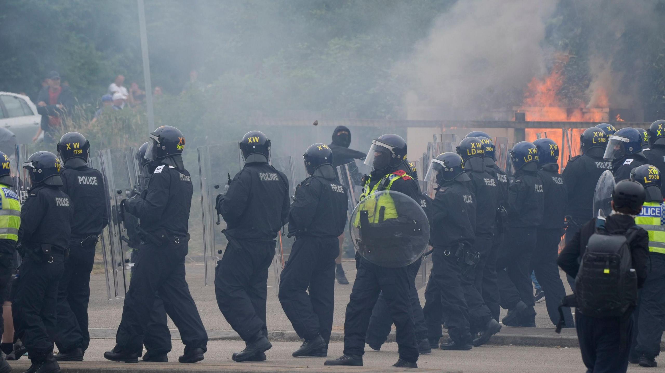 Police officers during an anti-immigration demonstration outside the Holiday Inn Express in Rotherham, South Yorkshire