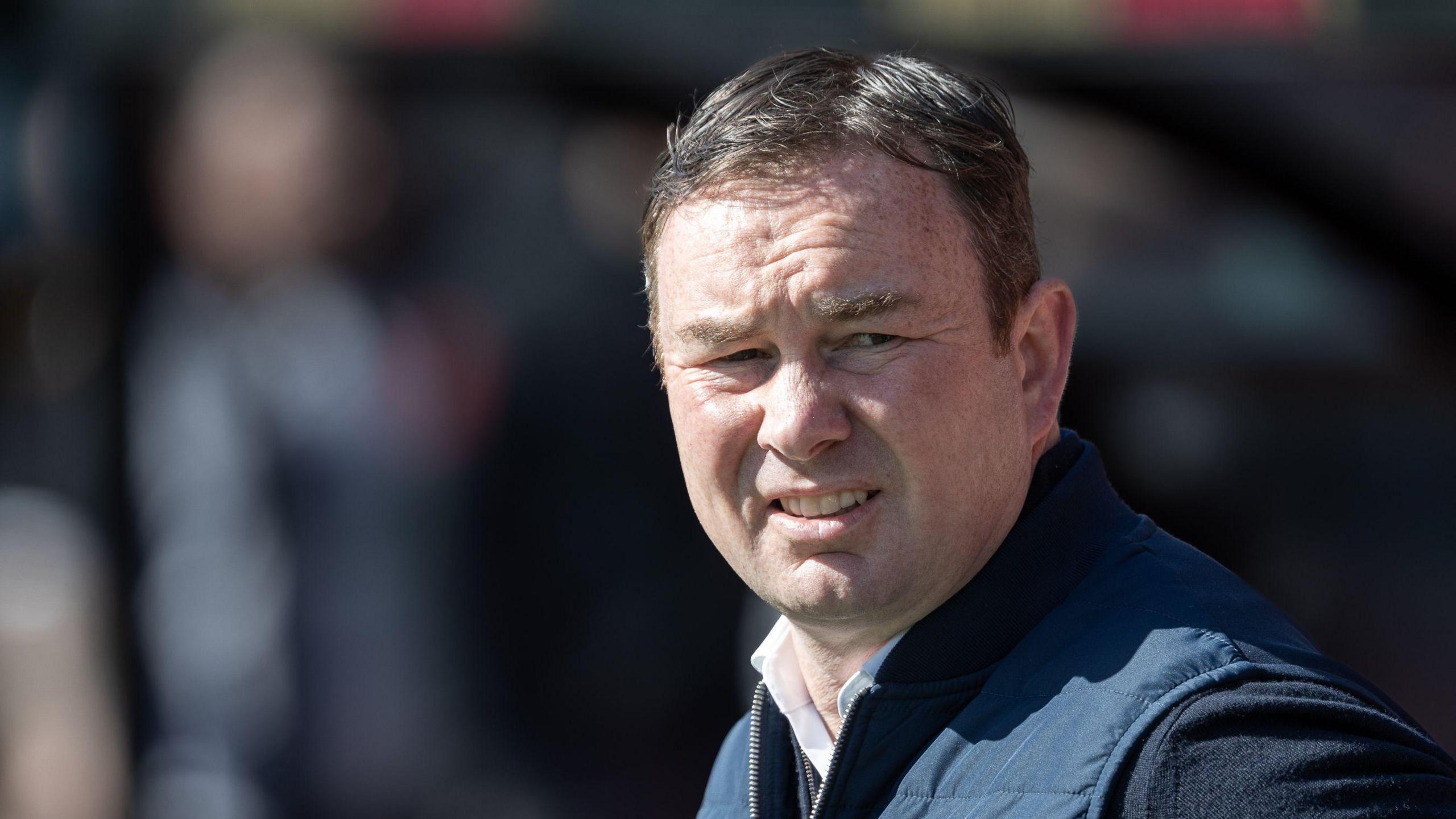 A close-up of Derek Adams