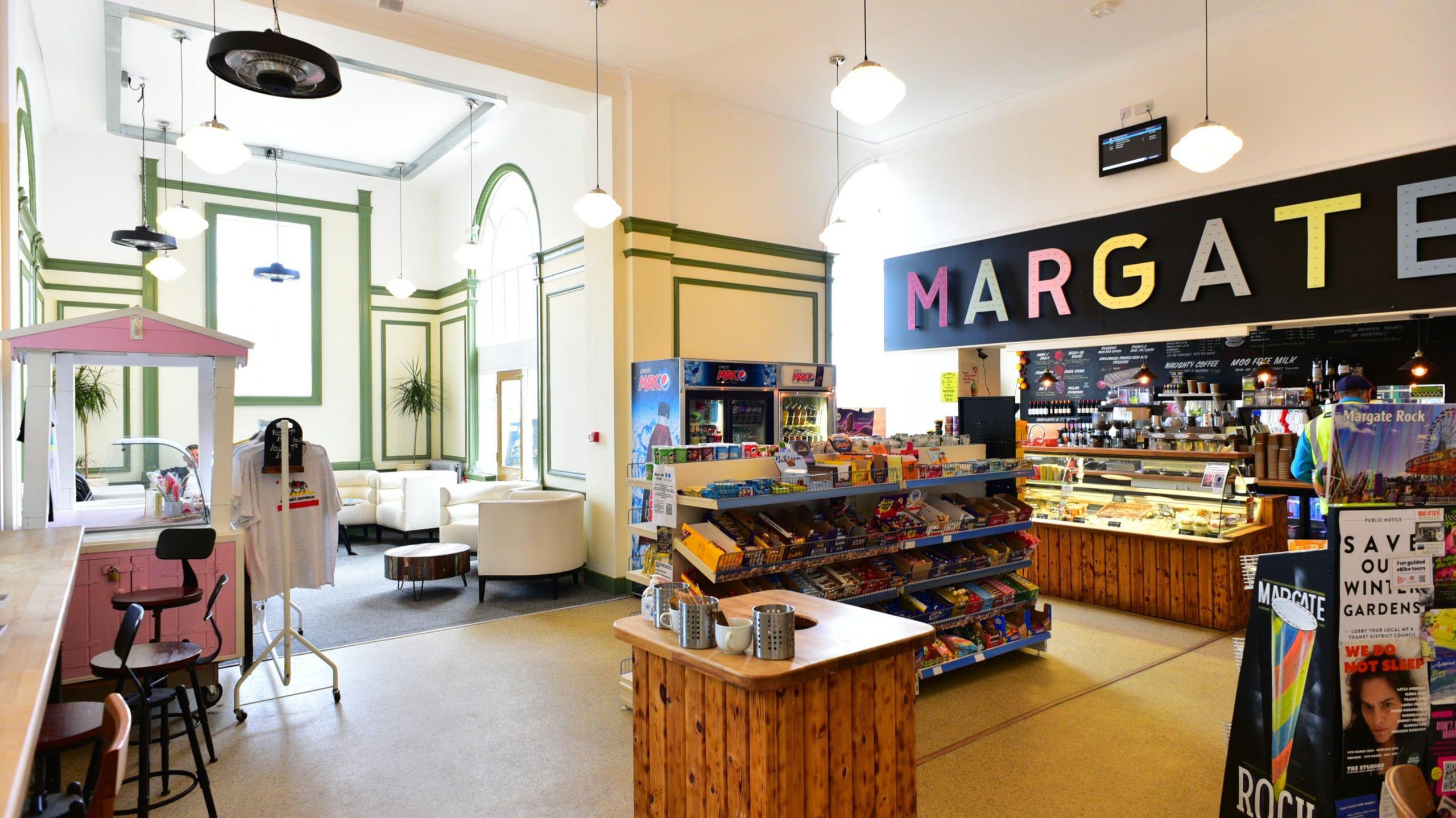 A picture of a café in Margate station, with Margate written in different colour letters above the kiosk of the café