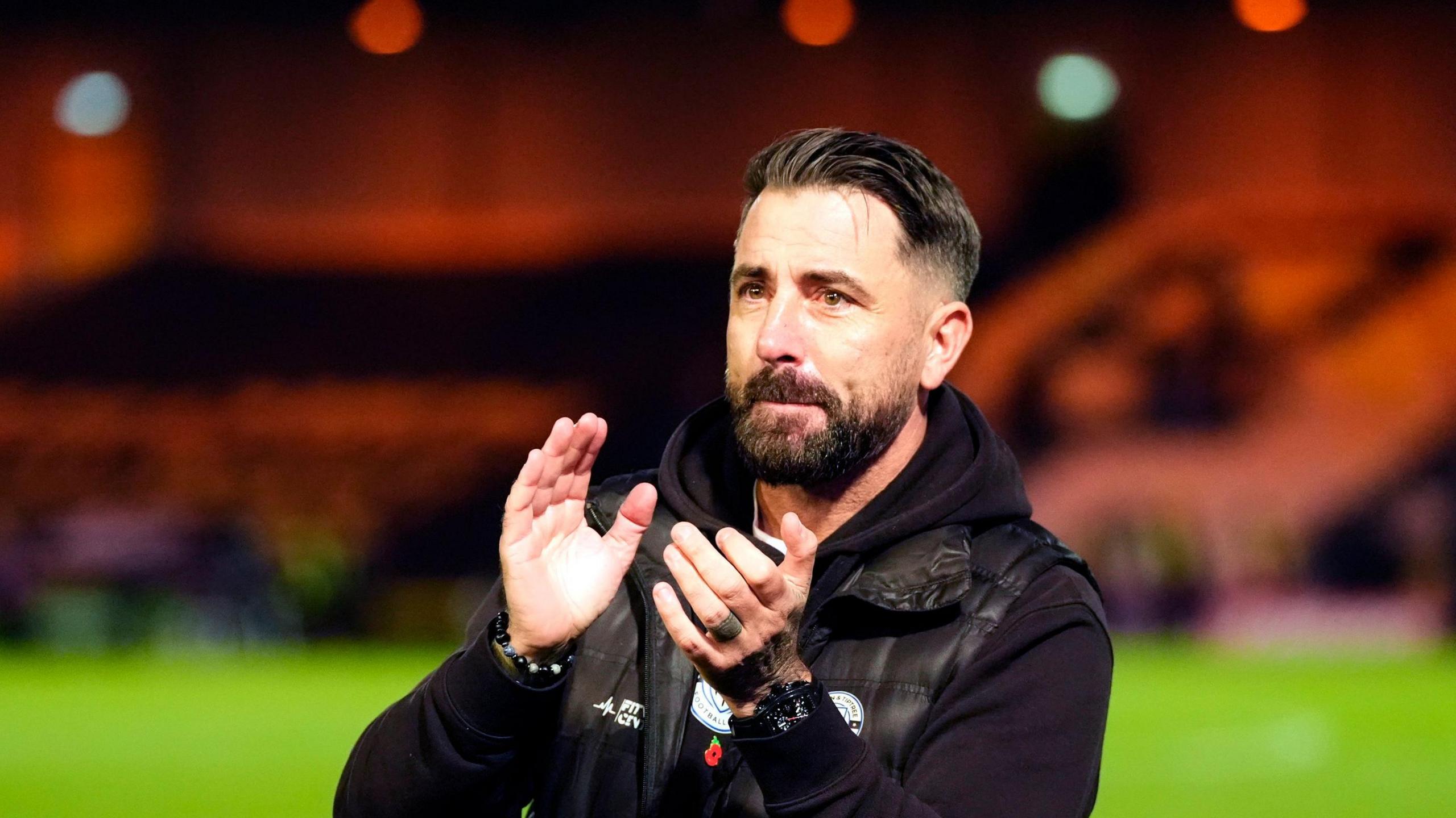 Maldon and Tiptree manager Kevin Horlock applauds on the touchline at Vale Park after his side's FA Cup exit