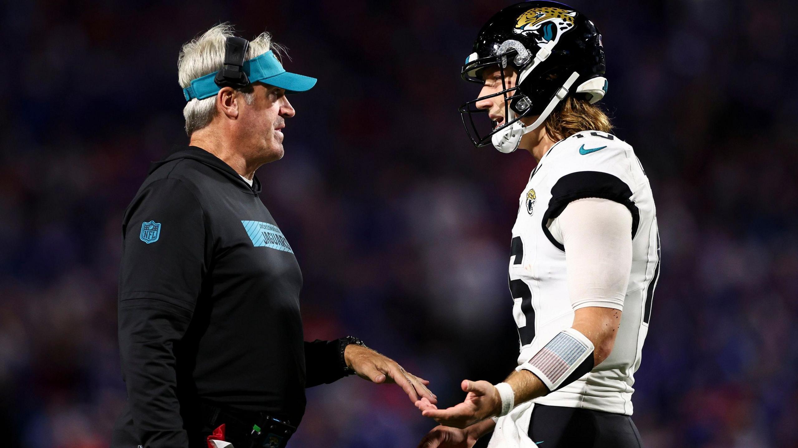 Jacksonville Jaguars head coach Doug Pederson talks with quarterback Trevor Lawrence