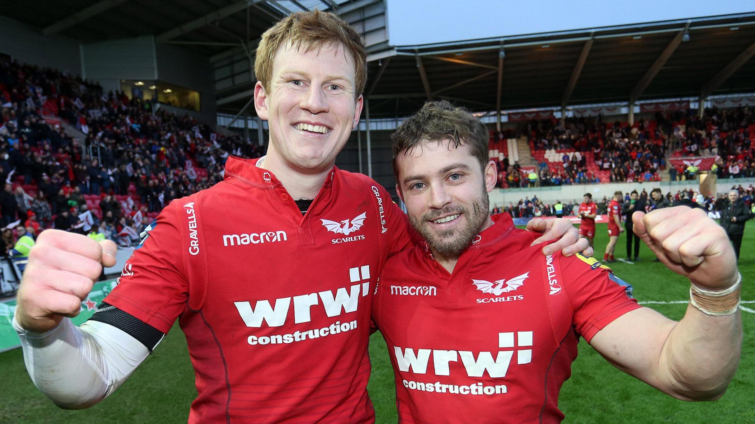 Rhys Patchell and Leigh Halfpenny celebrate a Scarlets victory